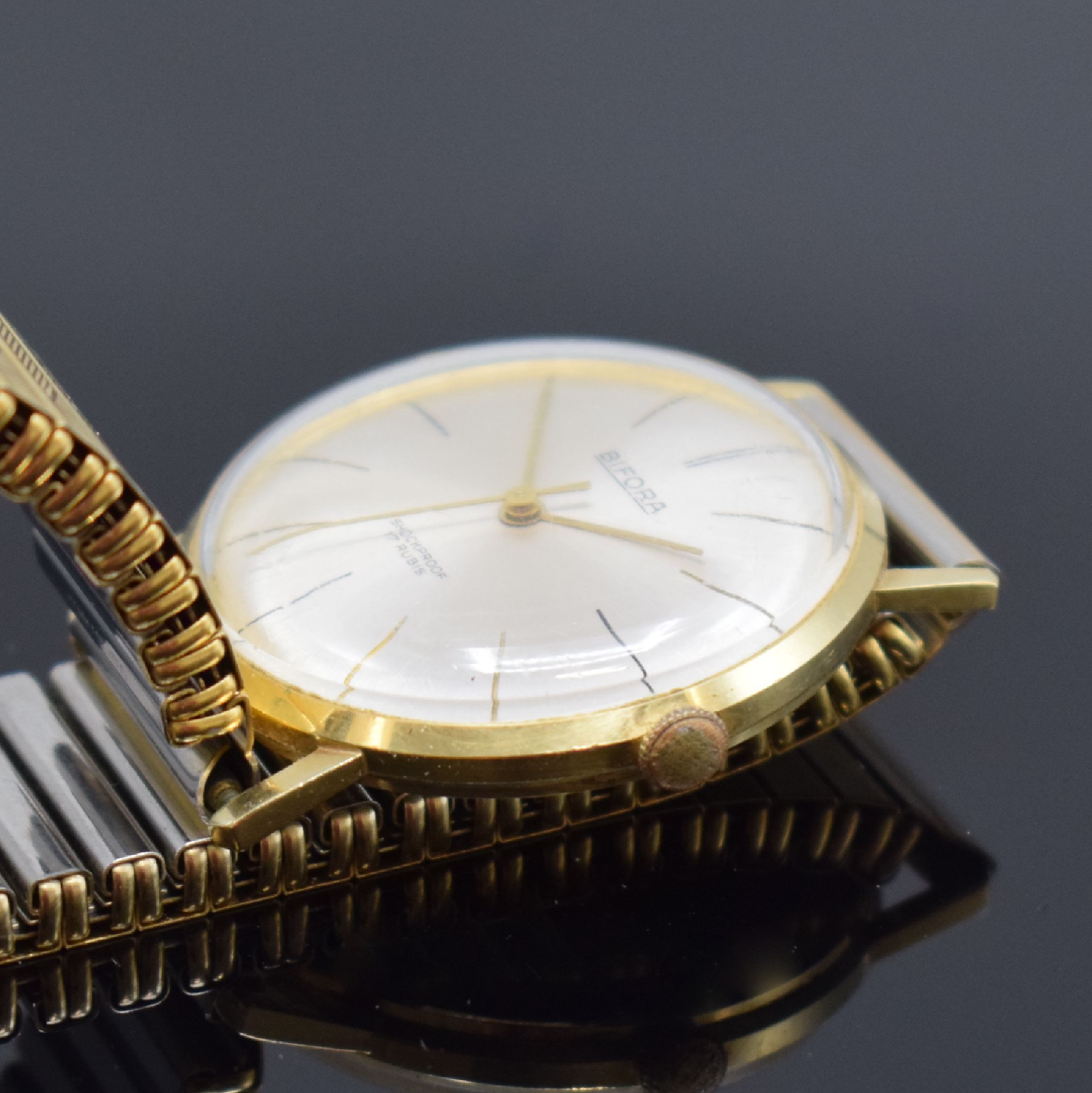 Detail b: BIFORA Herrenarmbanduhr in GG 585/000, Schweiz um 1970, Handaufzug, Boden aufgedr., verg. Flexband, silb. Zifferbl. m. gold. Std.-Ind., gold. Zeiger, ...