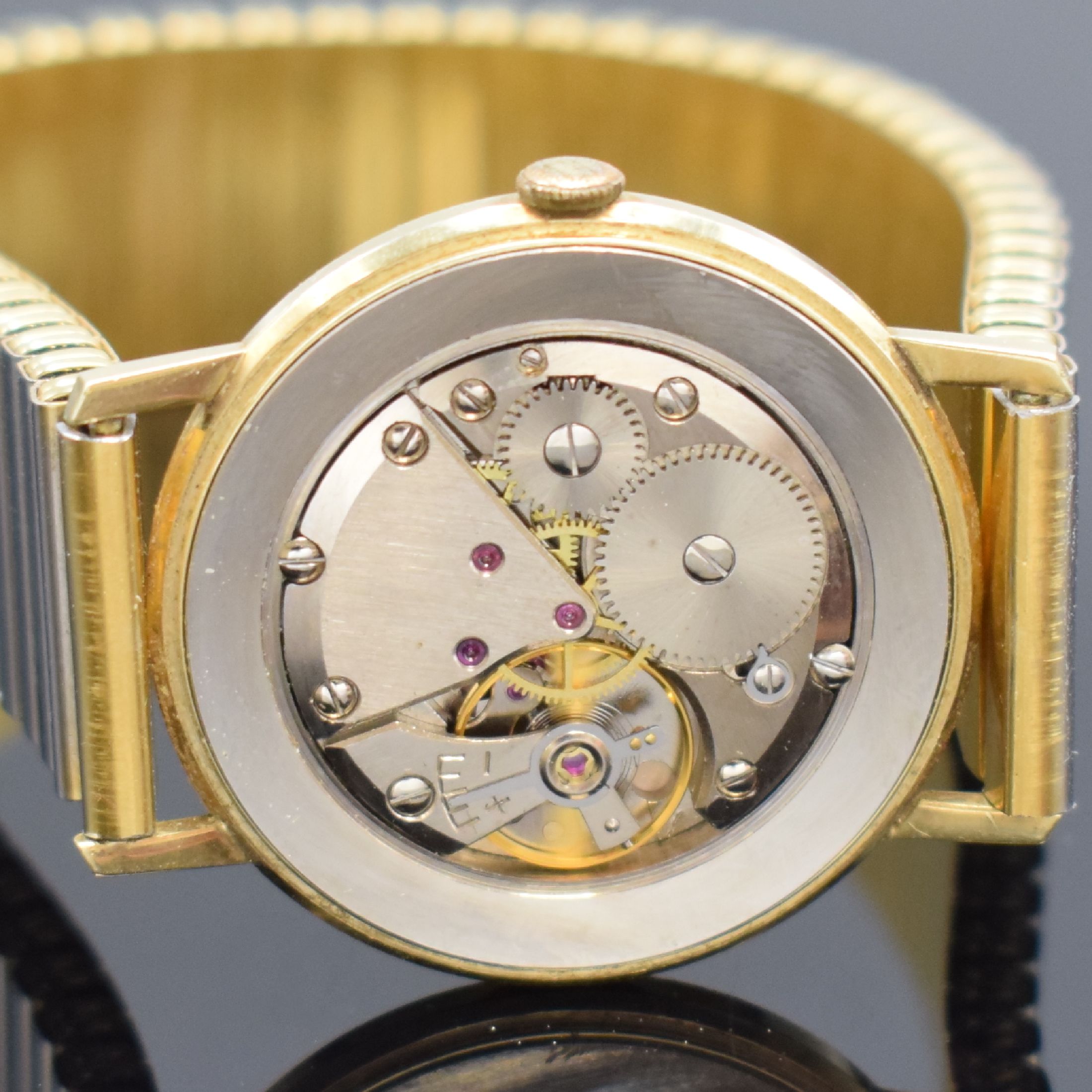 Detail d: BIFORA Herrenarmbanduhr in GG 585/000, Schweiz um 1970, Handaufzug, Boden aufgedr., verg. Flexband, silb. Zifferbl. m. gold. Std.-Ind., gold. Zeiger, ...