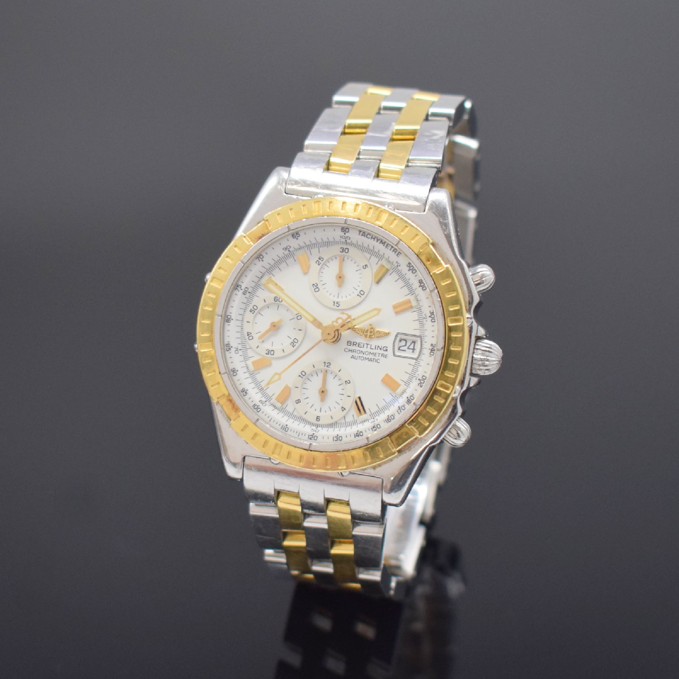 BREITLING Herrenchronograph in Stahl / Gold Referenz D13352, Schweiz um 2000, Automatik, verschr. Geh. m. orig. Pilotband, eins. drehb. gold. ...