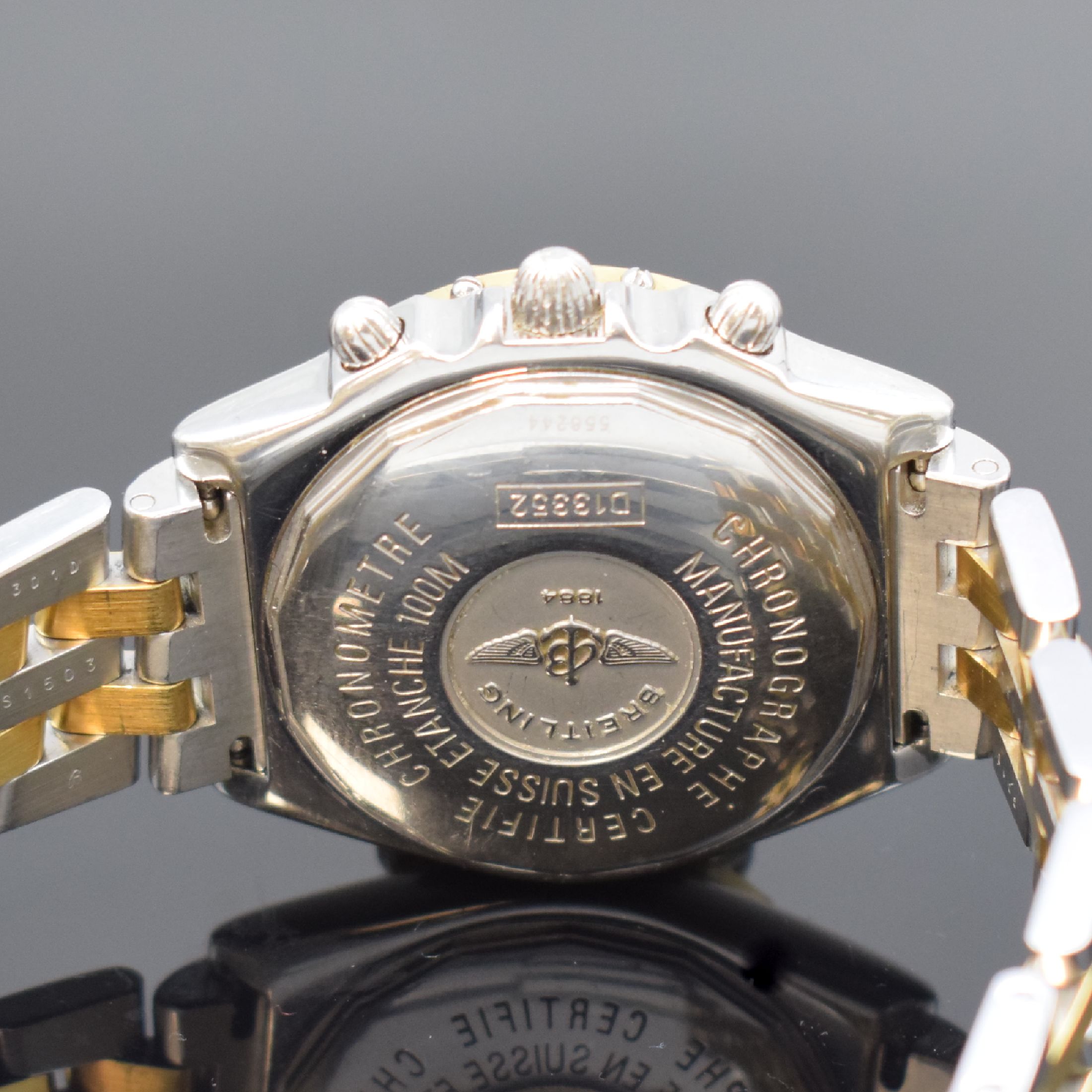 Detail c: BREITLING Herrenchronograph in Stahl / Gold Referenz D13352, Schweiz um 2000, Automatik, verschr. Geh. m. orig. Pilotband, eins. drehb. gold. ...
