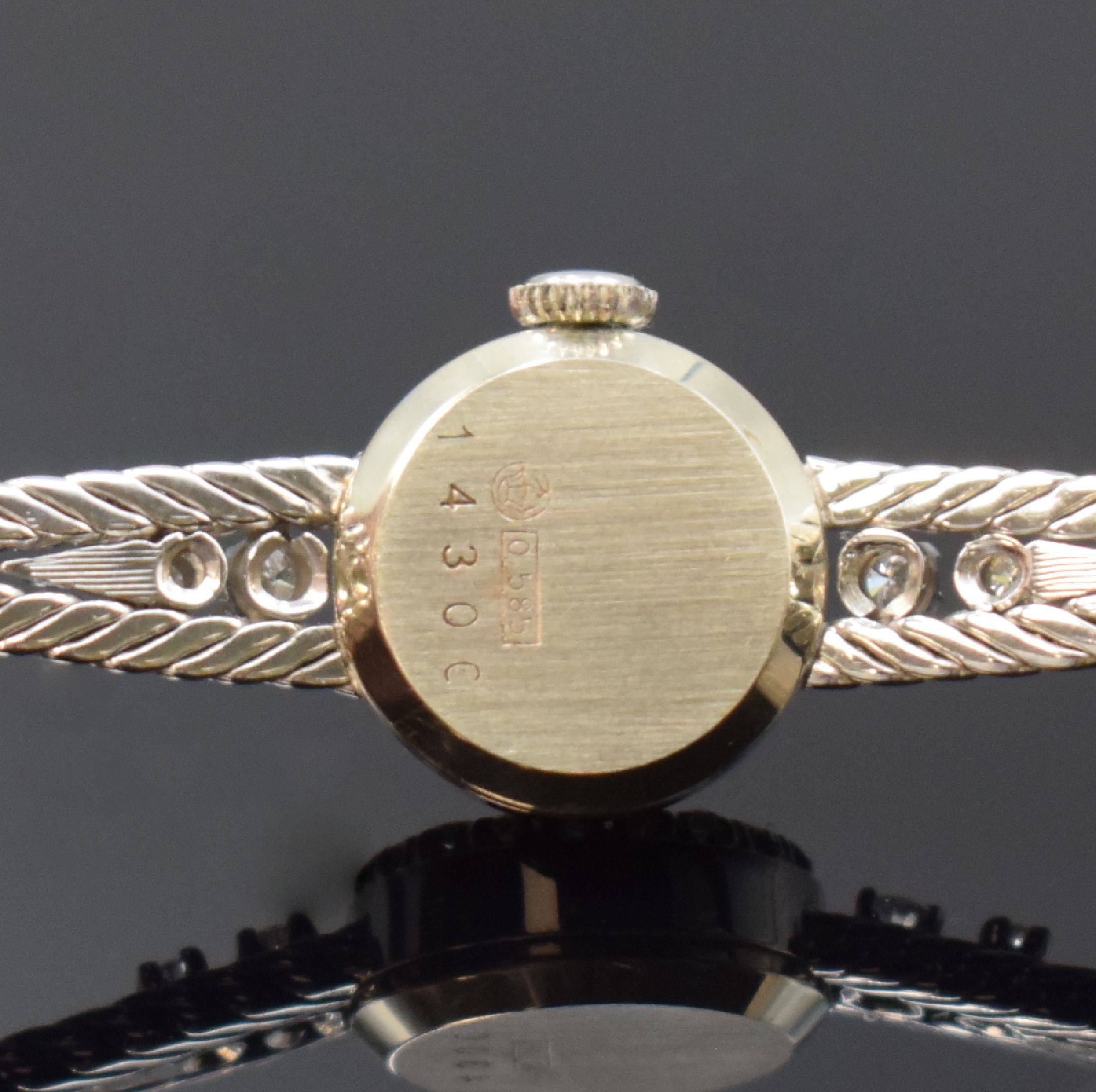 Detail c: MERIT Damenarmbanduhr in WG 585/000 mit Diamanten, Schweiz um 1970, Handaufzug, Boden aufgedr., Lünette aufw. m. Diamanten bes., silb. Zifferbl. m. ...