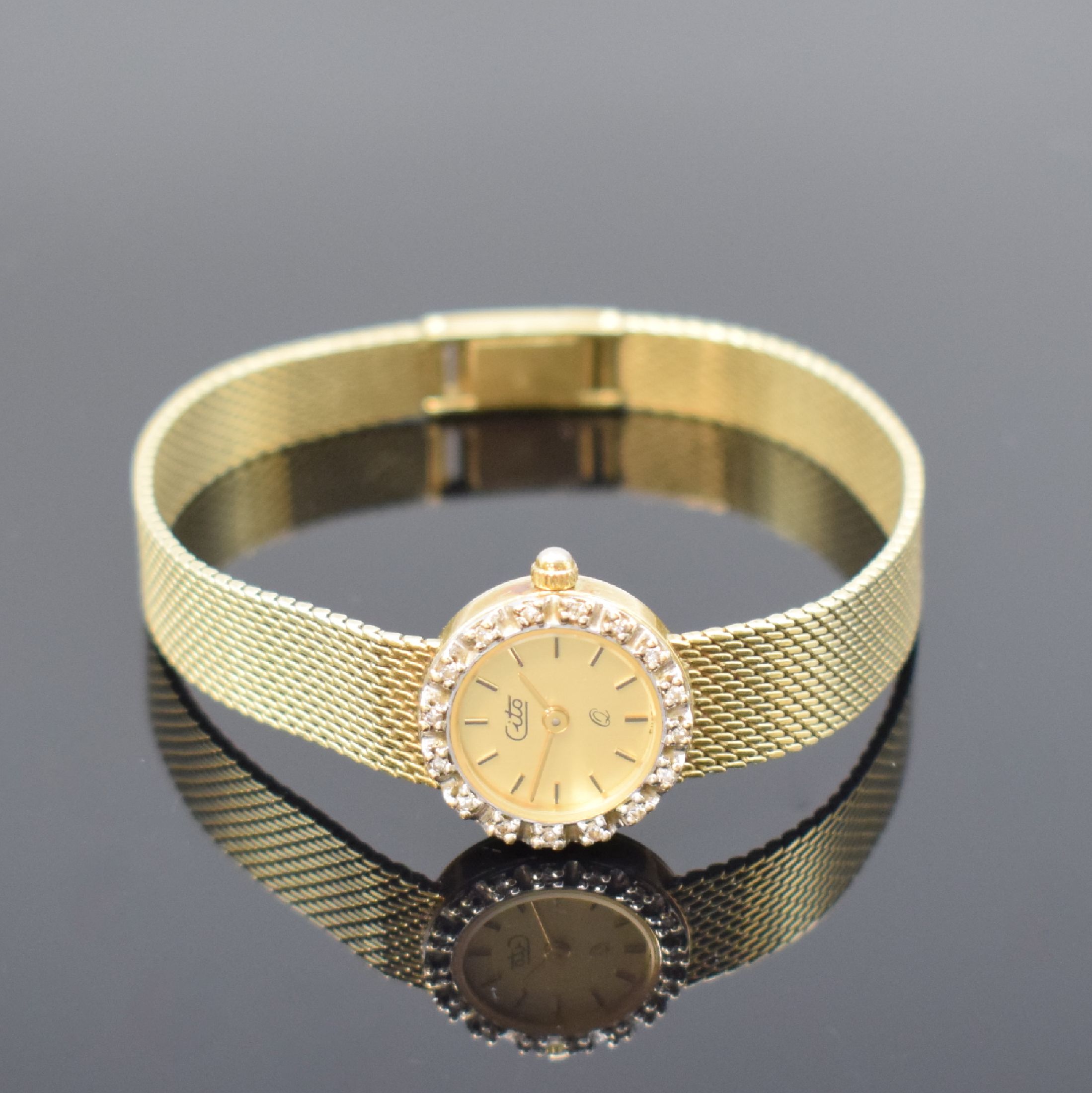 CITO Damenarmbanduhr in GG 585/000 mit Diamanten, Schweiz um 1975, quarz, Lünette aufw. m. Diamanten bes., Boden aufgedr., champagnerfarb. Zifferbl. ...