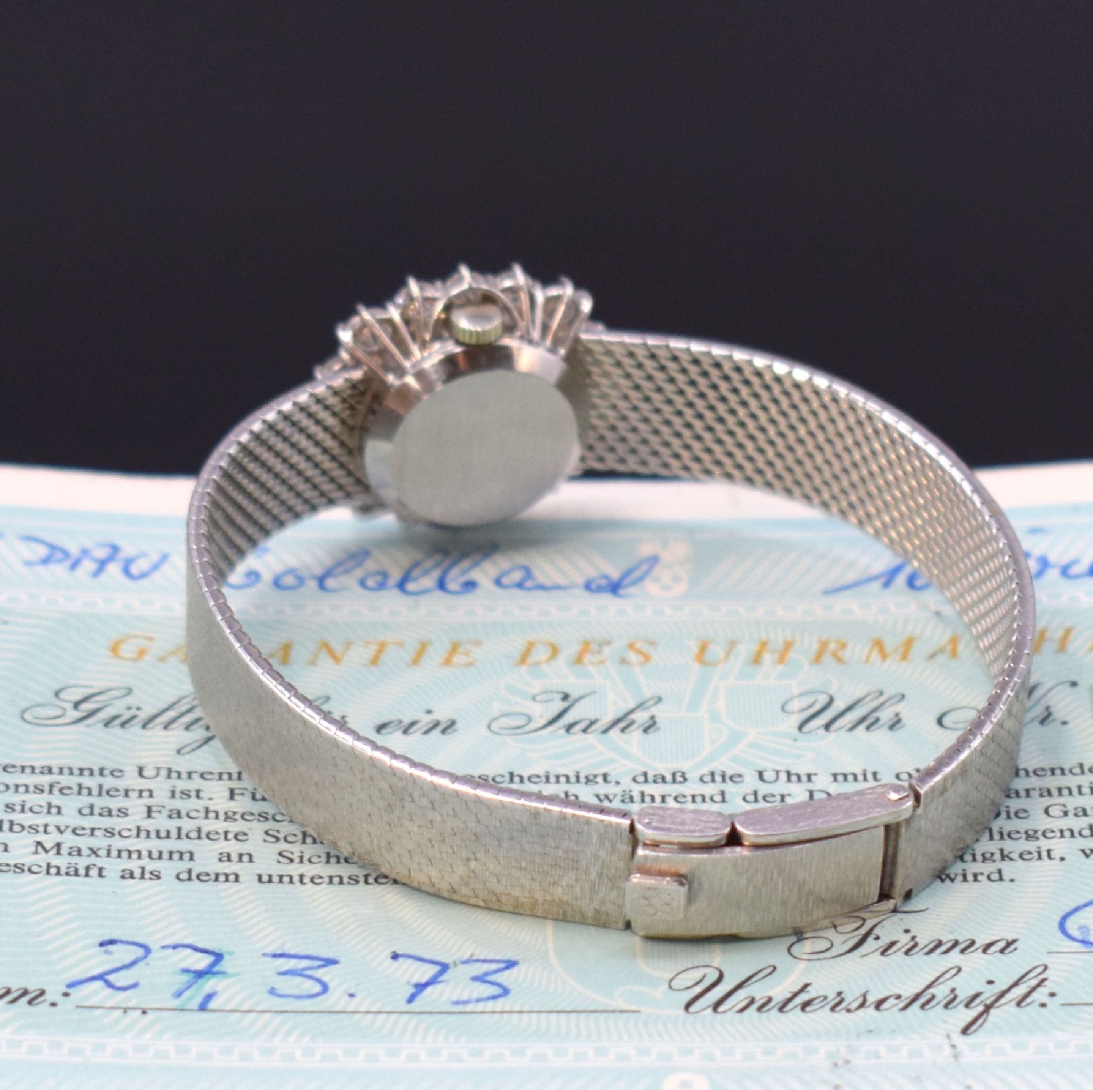 Detail b: ETERNA Damenarmbanduhr in WG 750/000 mit Diamanten, Schweiz verk. lt. beil. Garantie 03/1973, Handaufzug, Geh. an Goldband 750/000, Boden aufgedr., ...