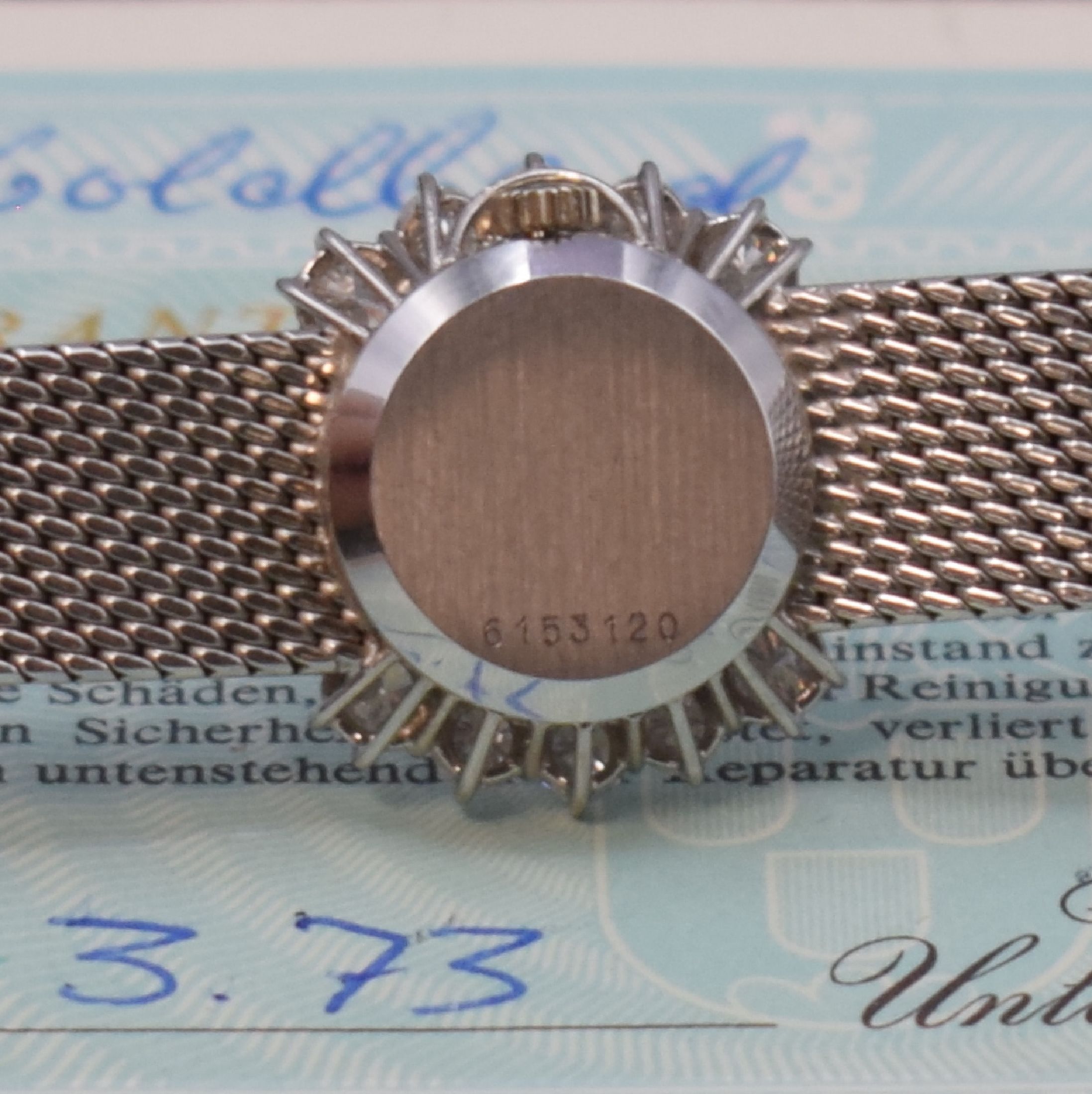 Detail d: ETERNA Damenarmbanduhr in WG 750/000 mit Diamanten, Schweiz verk. lt. beil. Garantie 03/1973, Handaufzug, Geh. an Goldband 750/000, Boden aufgedr., ...