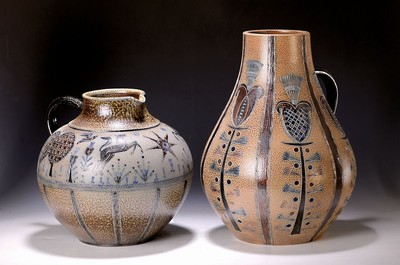 Image Two large handle jugs, Töpferhof Mühlendyck, 1970s, stoneware, salt glaze in blue and brown, incised decoration with horses, butterflies and trees or with a variety of flowers, each bulbous body, handle, traces of age, one with incised mark on the bottom, H. 42/32 cm