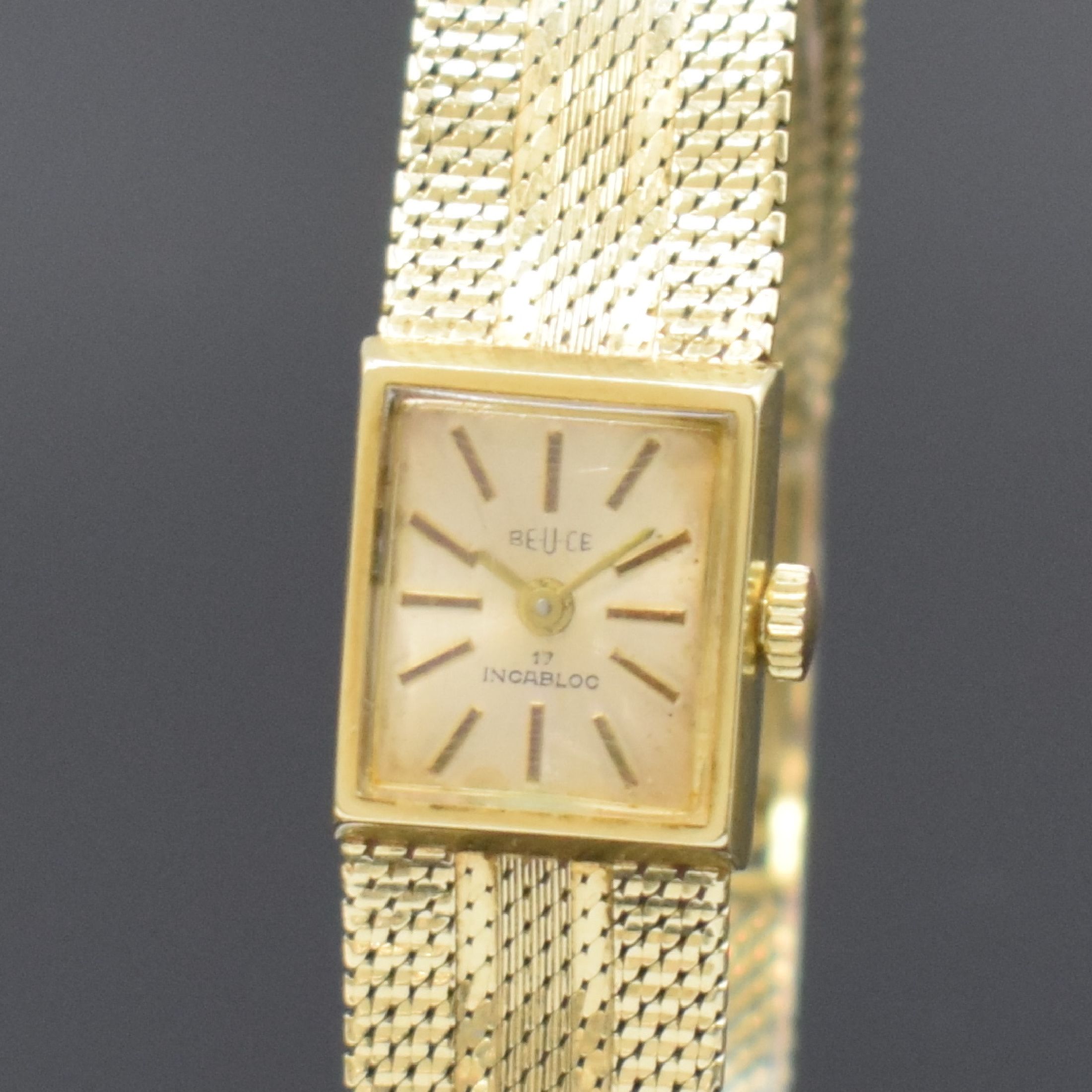 Detail a: BEUCE / NIVADA Armbanduhr in GG 585/000, Schweiz um 1975, Handaufzug, Boden aufgedr., silb. Zifferbl. m. gold. Std.-Ind. altersbed. pat., gold. ...