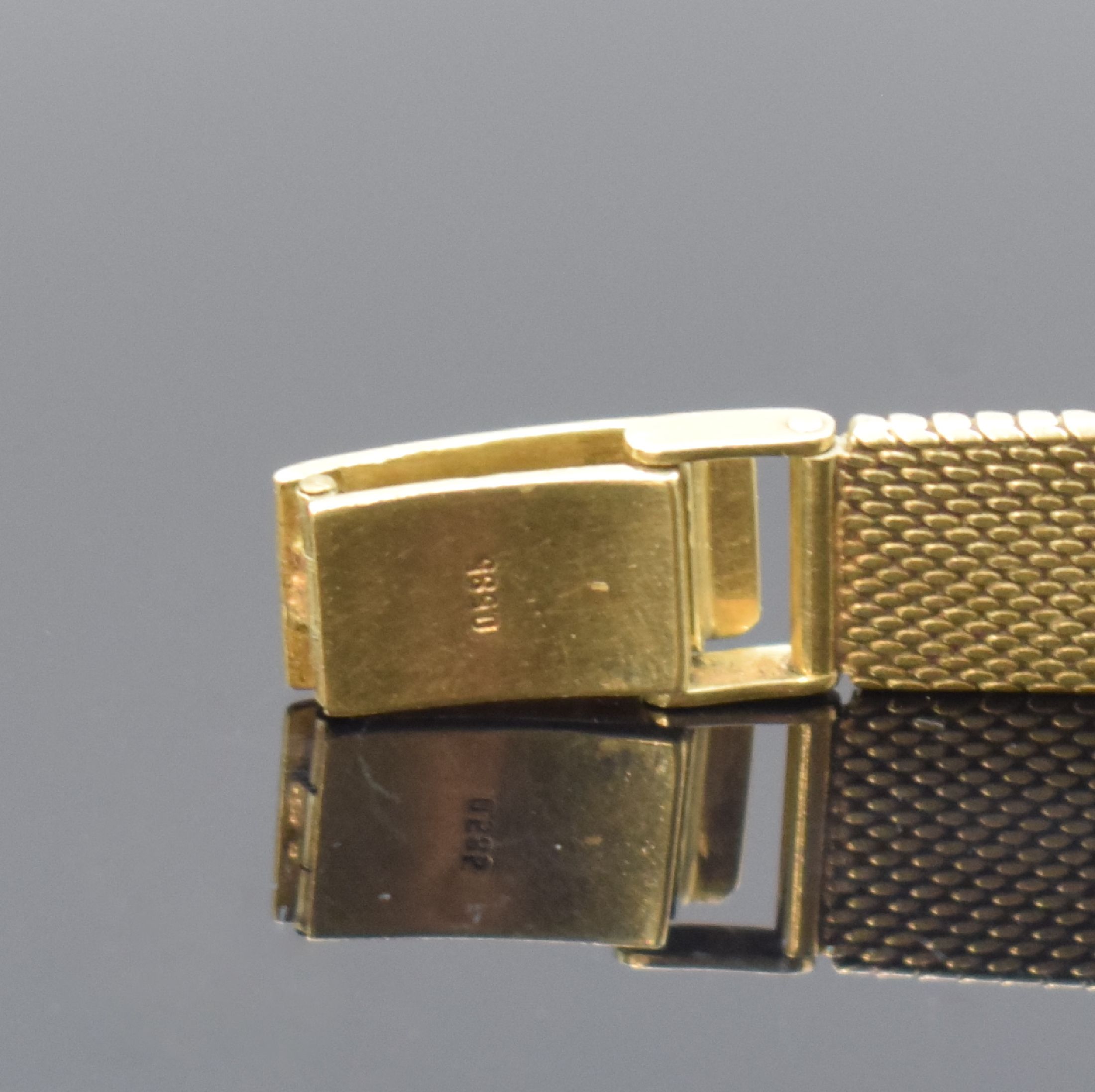 Detail b: BEUCE / NIVADA Armbanduhr in GG 585/000, Schweiz um 1975, Handaufzug, Boden aufgedr., silb. Zifferbl. m. gold. Std.-Ind. altersbed. pat., gold. ...