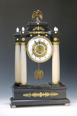 Image Portal clock, with supplemented movement, around 1830/40, wooden case, sec. colored, alabaster columns, crown parts partly sec., glass lid, enamel numeral ring, separate innerdate ring, electric battery clockwork with pendulum drive 240/16, runs briefly, battery is missing, in front of it orig. Movement, this one incomplete, gongs removed, etc., datedisplay without function, revision essential, H. approx. 58cm, housing 2