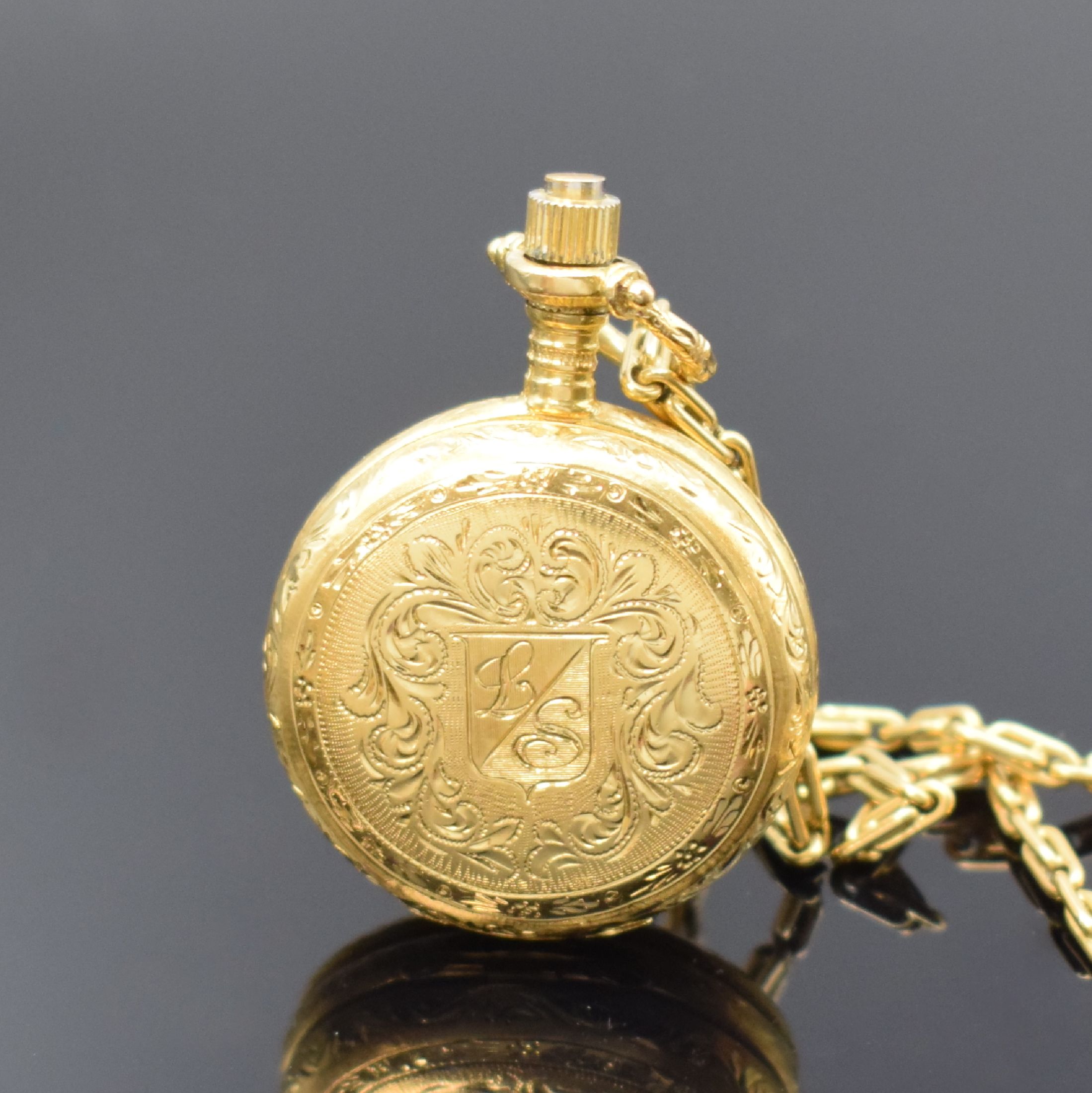 Detail a: Damensavonette in GG 750/000 mit Kette in GG 750/000, Schweiz um 1970, Handaufzug, floral grav. Geh., Boden aufgedr., grav. Zifferbl. m. röm. ...