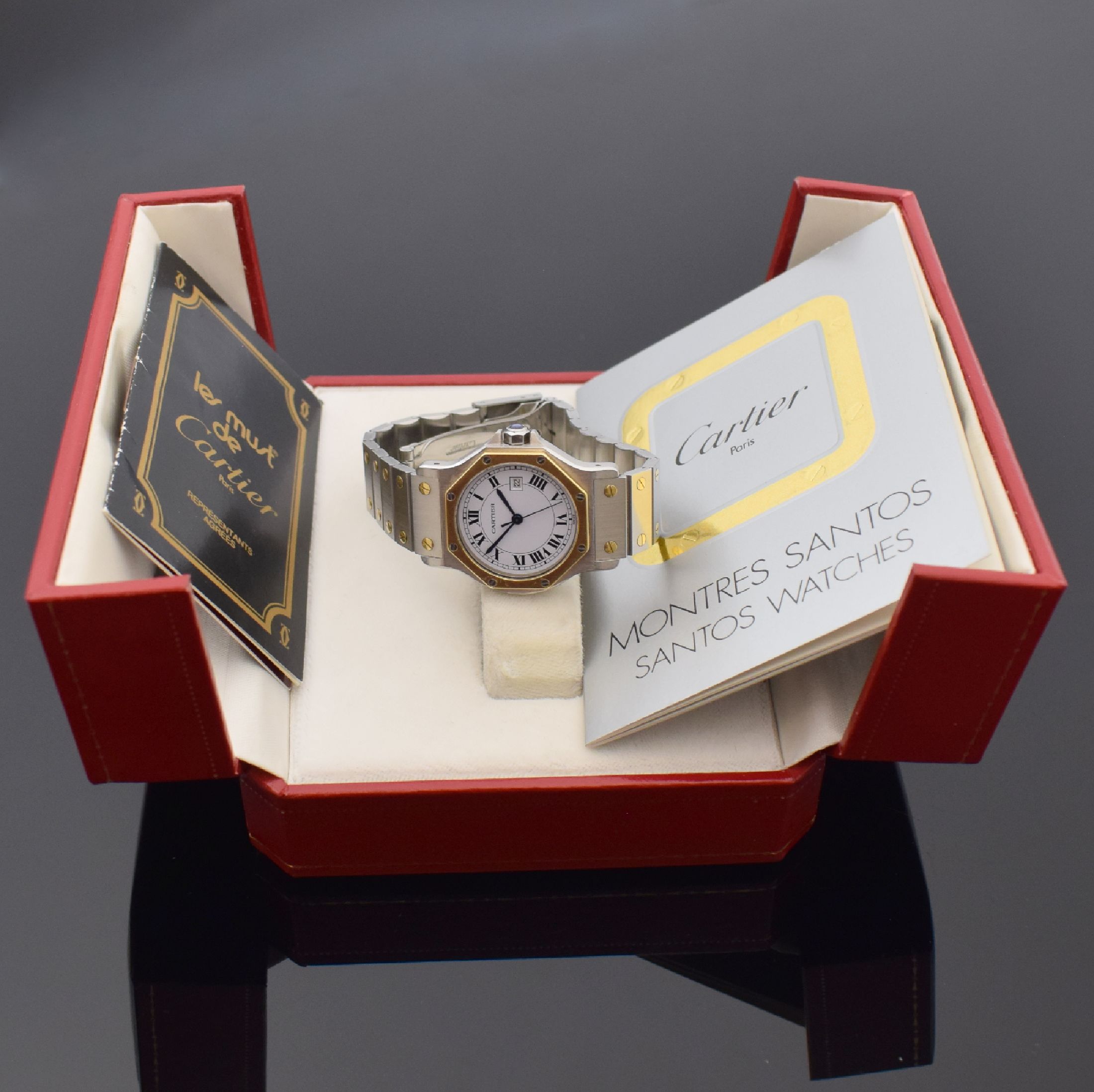 Detail e: CARTIER Santos Armbanduhr in Stahl/Gold, Schweiz um 1995, Automatik, 8-fach verschr. Monocoque-Geh., 8-eckige Lünette (Goldhaube), orig. Gliederband ...