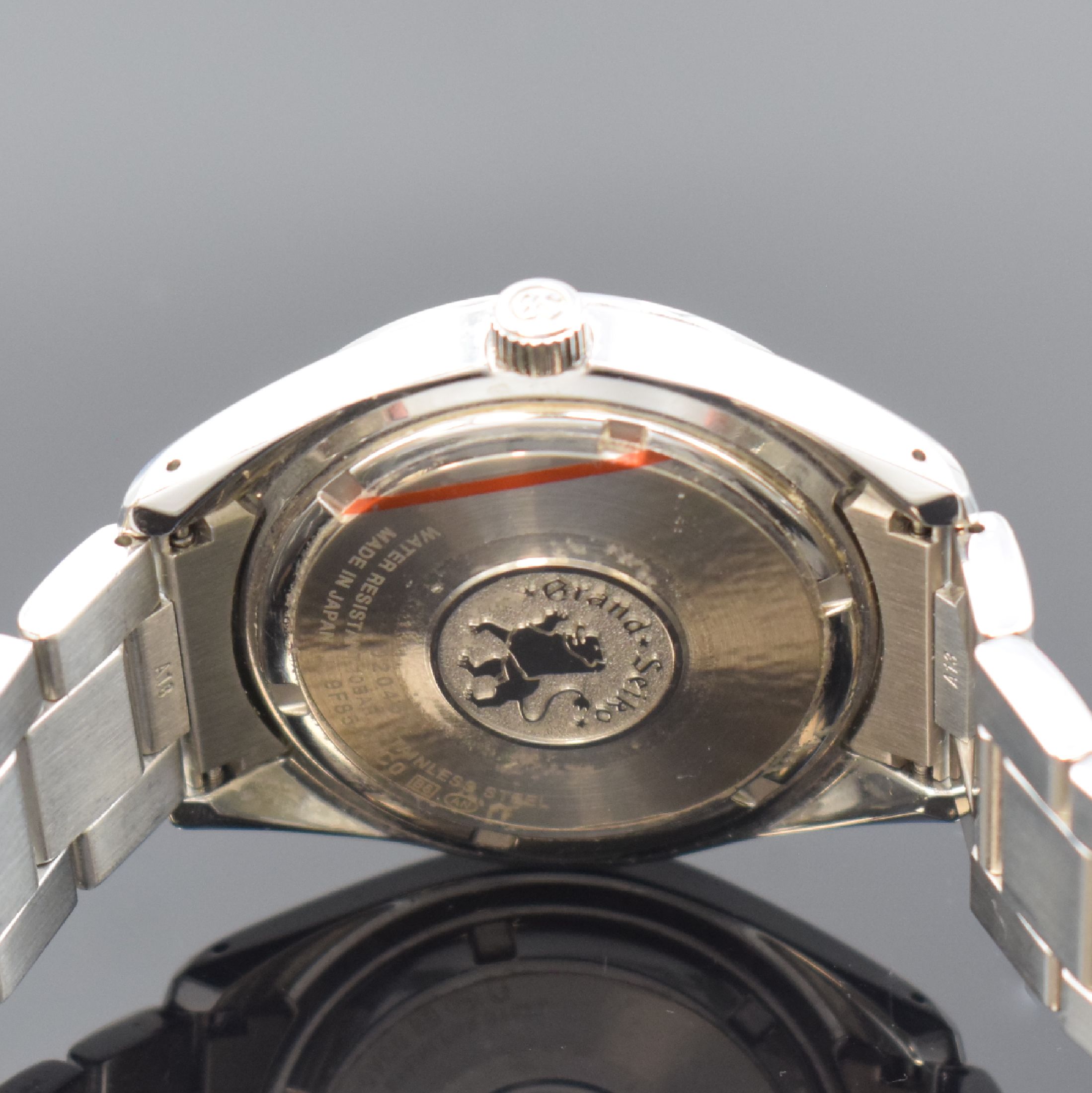 Detail d: GRAND SEIKO Herrenarmbanduhr Heritage Quartz Referenz 9F85-OACO, Japan um 2020, Edelstahlgeh. inkl. Gliederband m. Faltschl., Boden verschr., silb. ...
