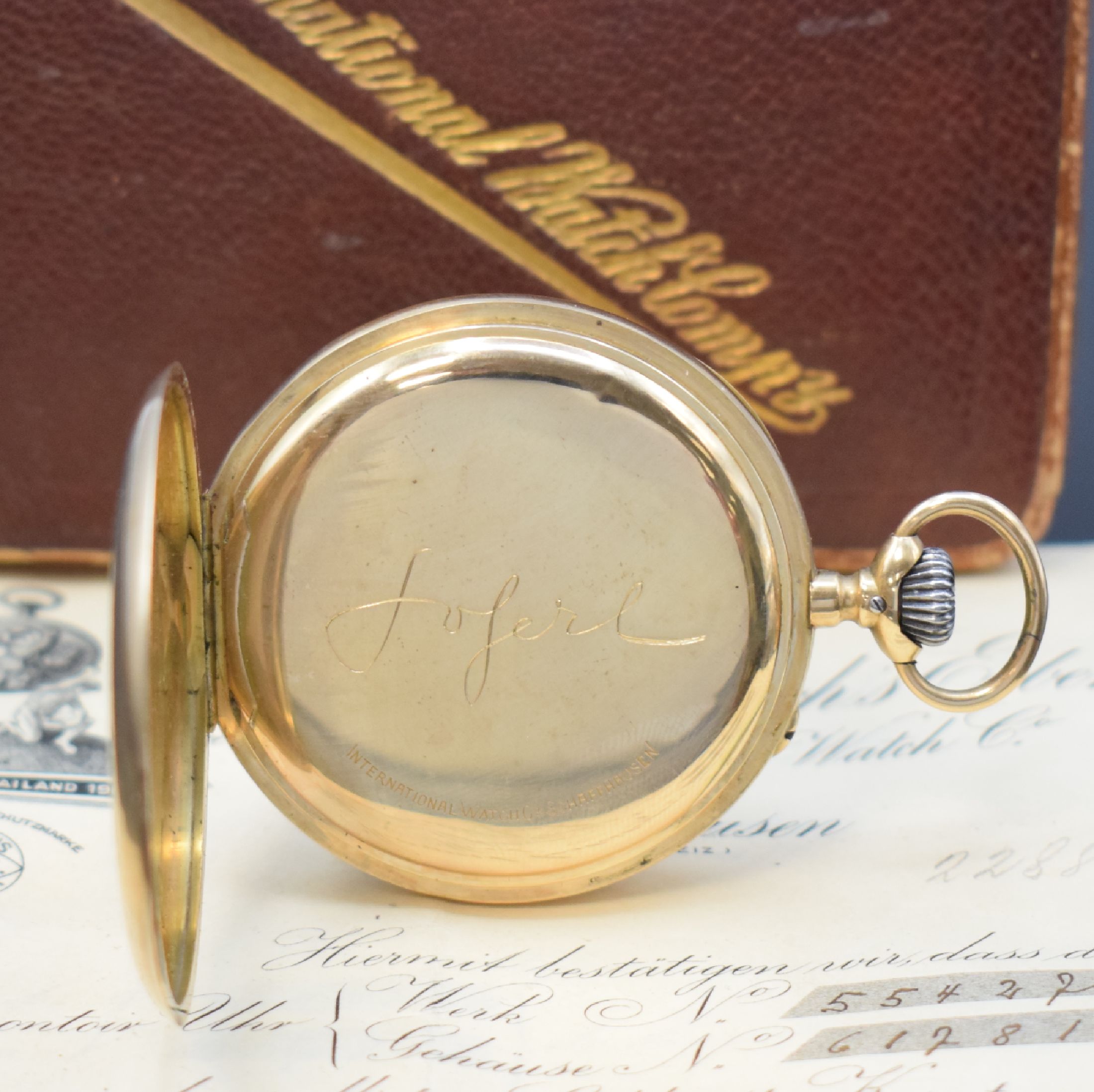 Detail c: IWC offene Taschenuhr in GG 585/000 mit Garantieschein und Etui, Schweiz um 1912, Geh. dell., guill. Rückdeckel m. Monogramm, Goldcuvette, ...