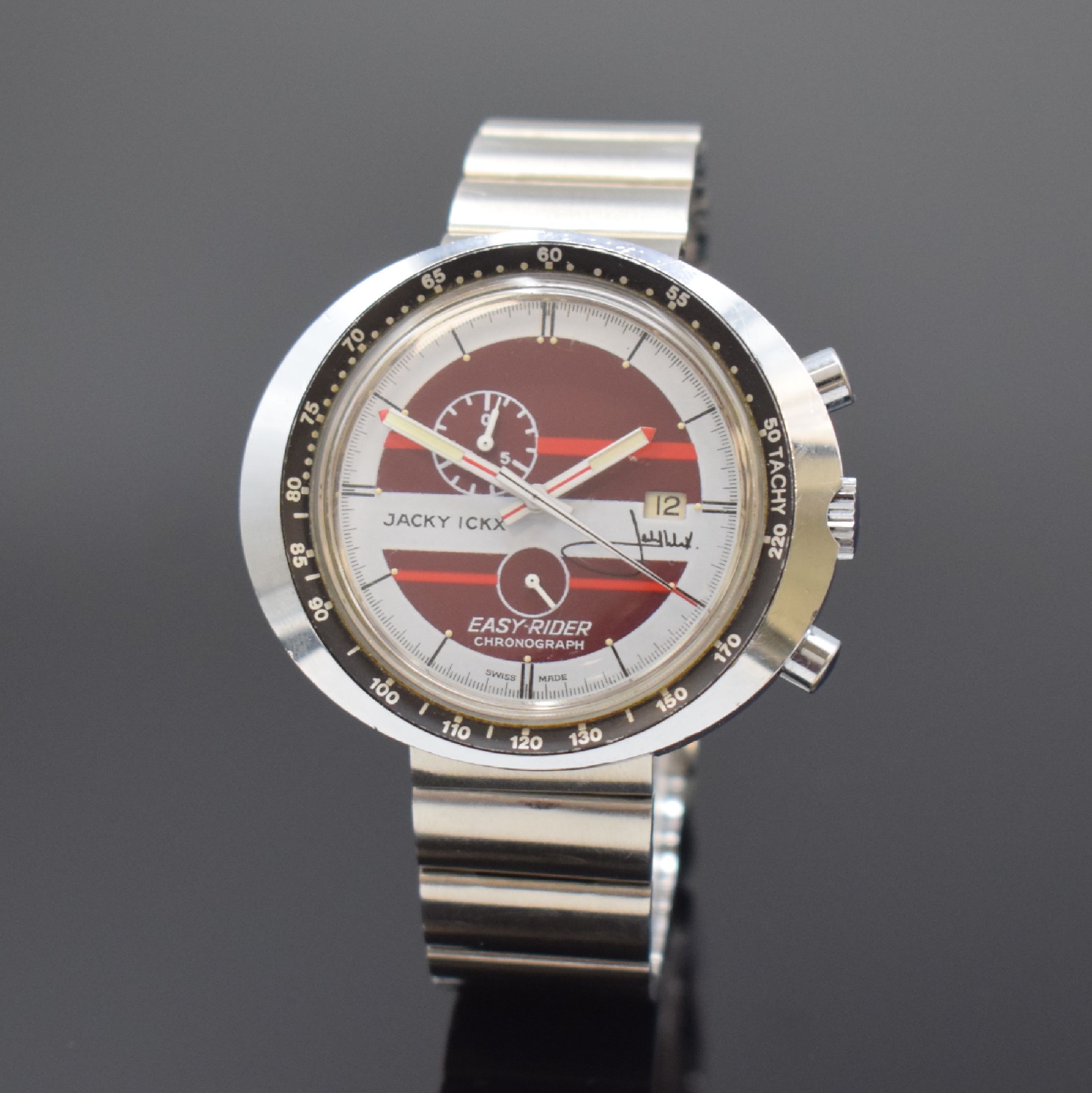 HEUER / JACKY ICKX Easy-Rider Armbanduhr mit Chronograph an Heuer Stahlband, Schweiz um 1970, Handaufzug, verchromtes Stülpgehäuse, Lünette m. ...