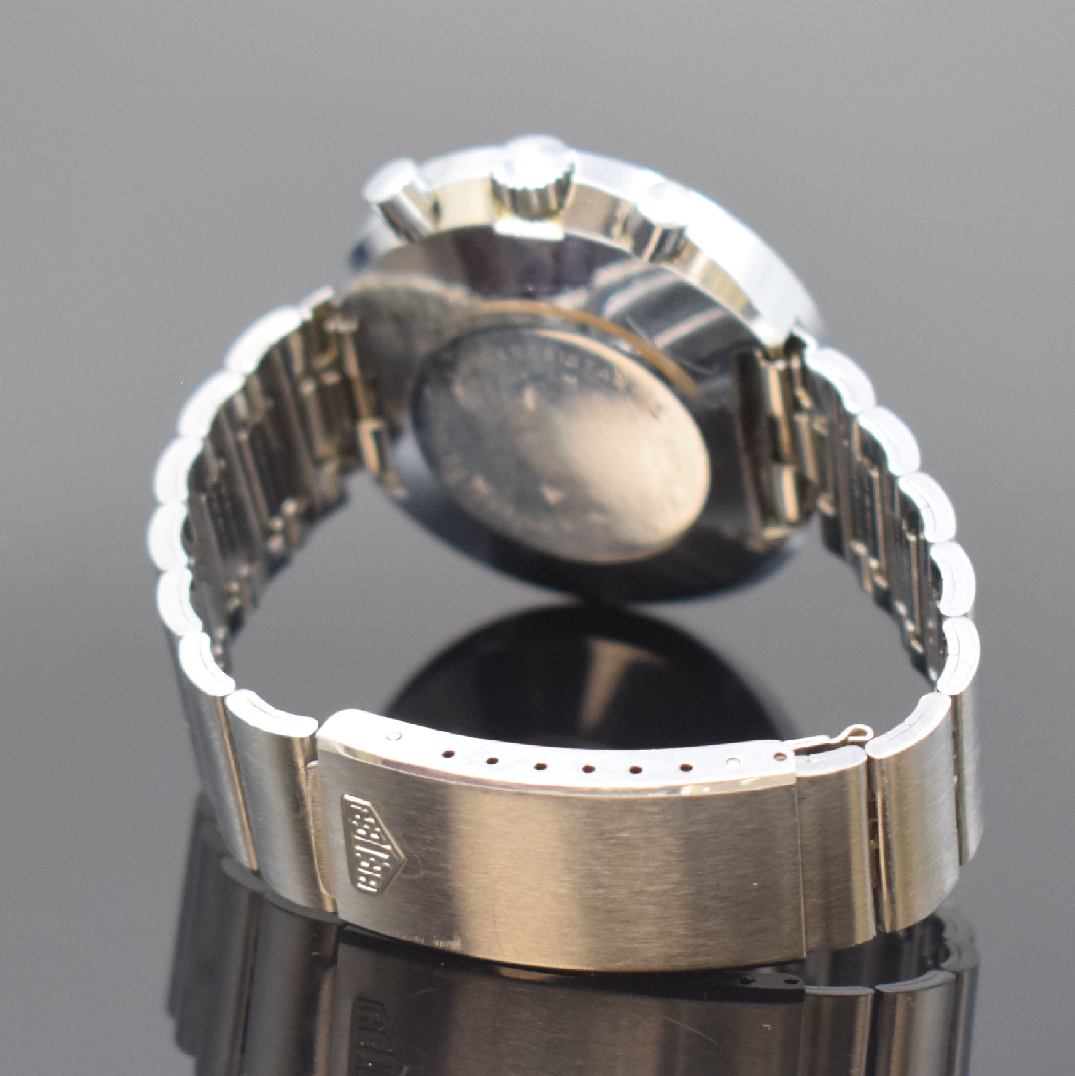 Detail b: HEUER / JACKY ICKX Easy-Rider Armbanduhr mit Chronograph an Heuer Stahlband, Schweiz um 1970, Handaufzug, verchromtes Stülpgehäuse, Lünette m. ...