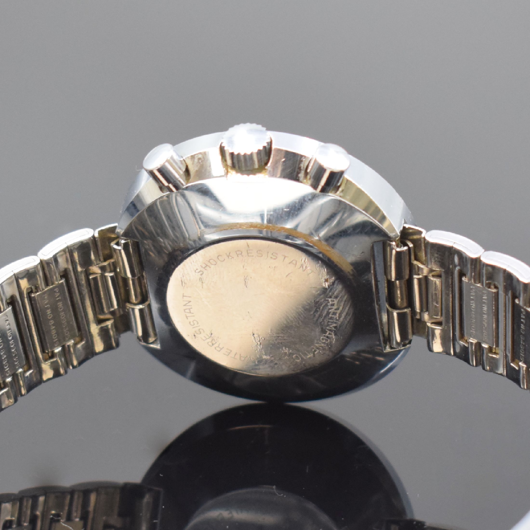 Detail d: HEUER / JACKY ICKX Easy-Rider Armbanduhr mit Chronograph an Heuer Stahlband, Schweiz um 1970, Handaufzug, verchromtes Stülpgehäuse, Lünette m. ...