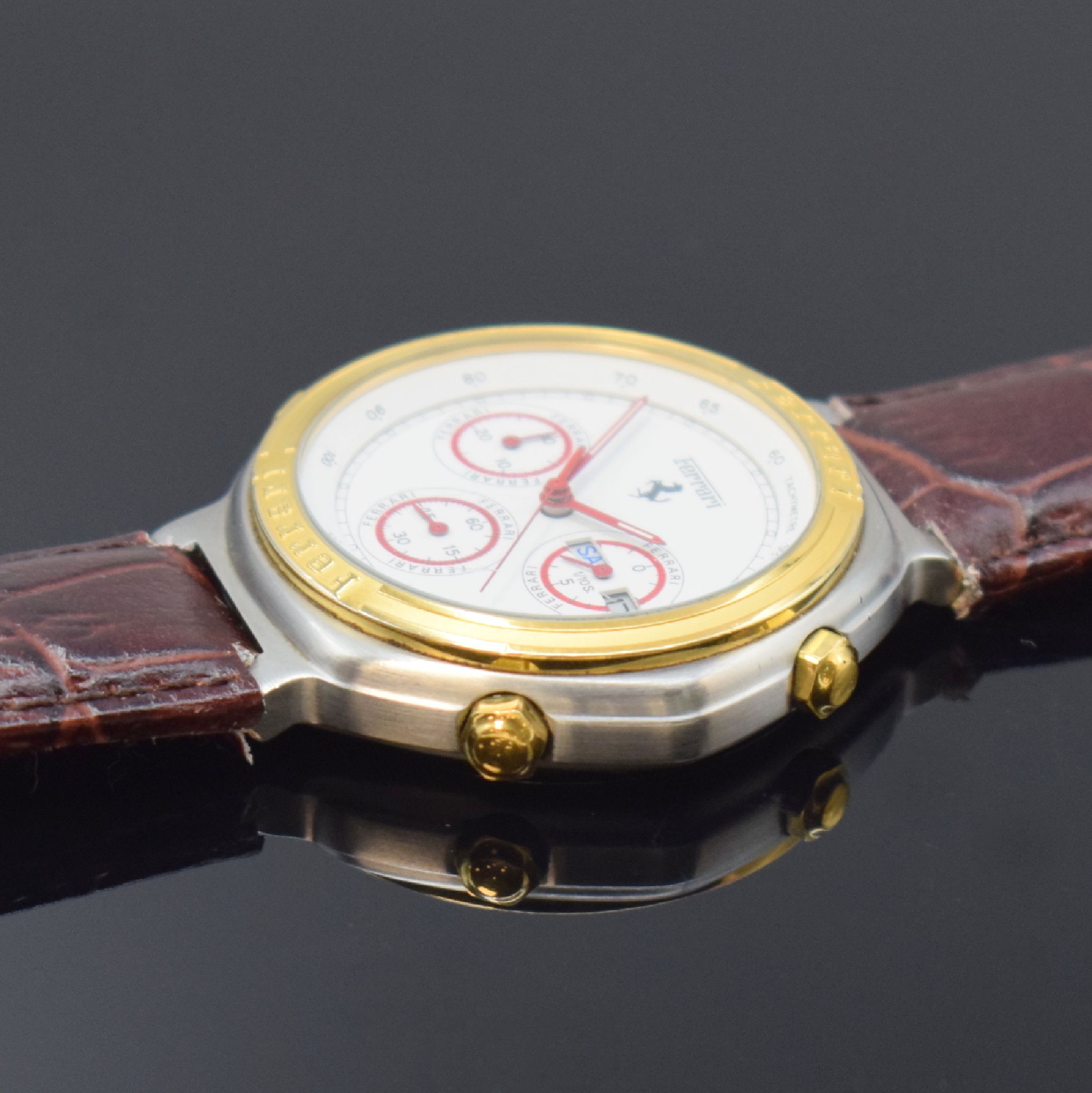 Detail b: FERRARI Herrenarmbanduhr mit Chronograph in Stahl, Schweiz um 1990, quarz, Boden verschr., weißes Zifferbl. m. roten Leuchtzeigern, kl. Sek. b. 6, ...
