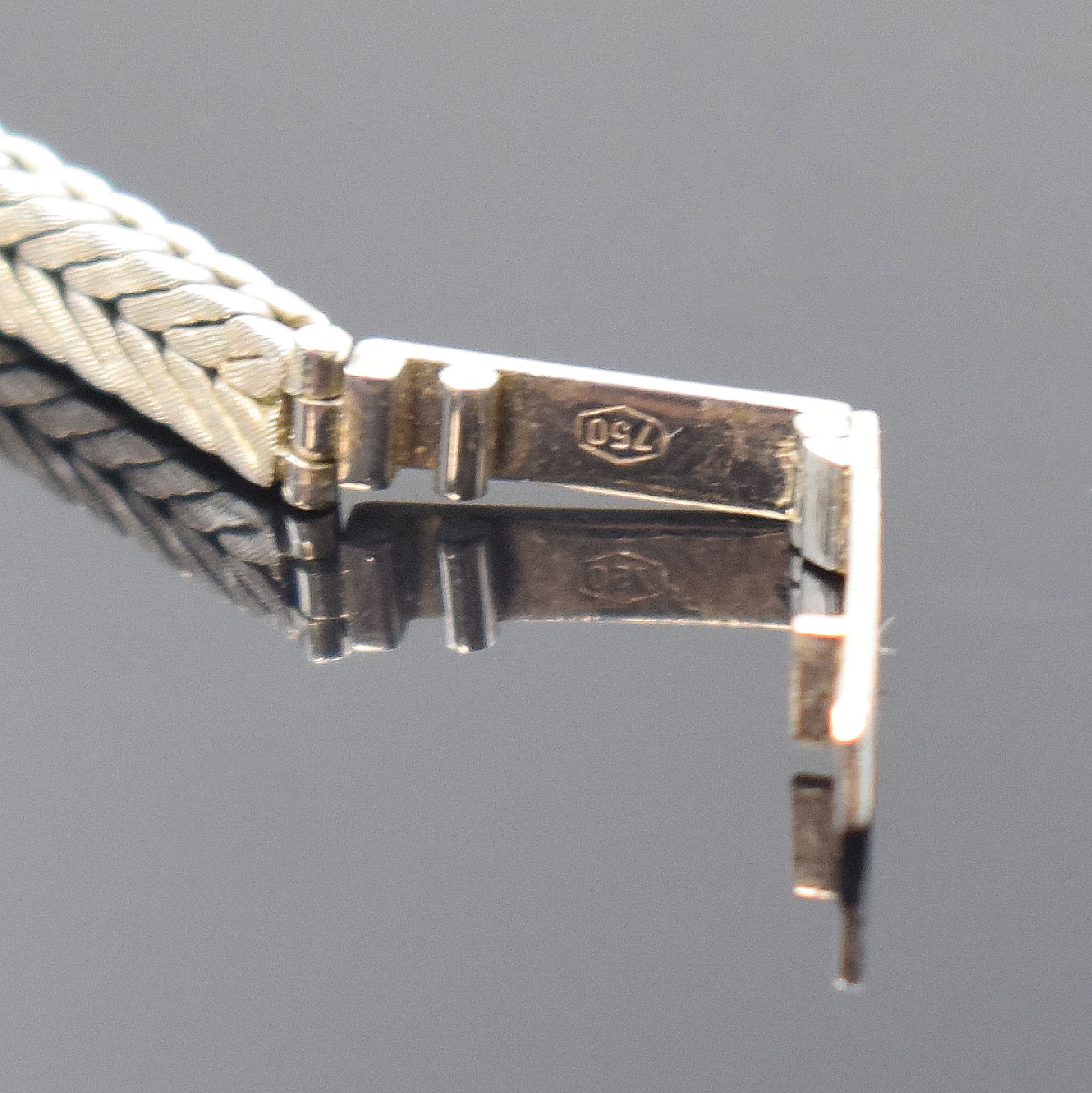 Detail b: NAVA Damengolduhr in WG 750/000 mit Diamanten, Schweiz um 1965, Handaufzug, Boden aufgedr., Lünette aufw. m. Diamanten bes., silb. Zifferbl. m. ...