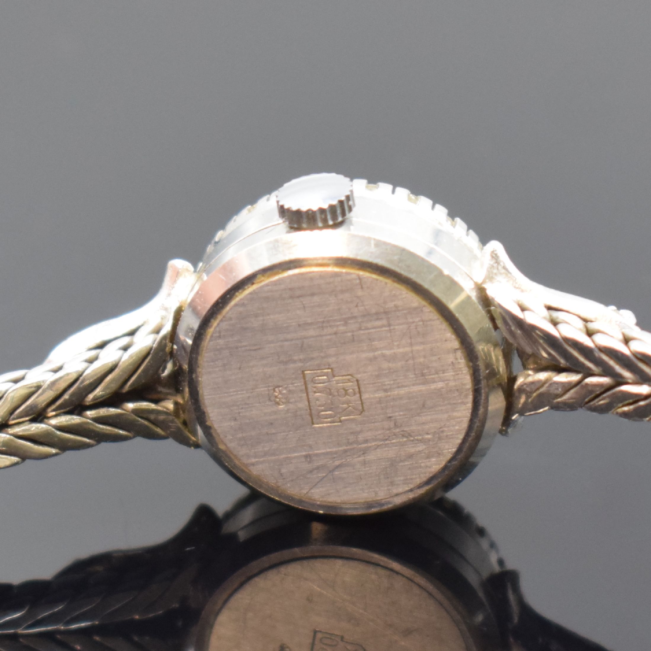 Detail c: NAVA Damengolduhr in WG 750/000 mit Diamanten, Schweiz um 1965, Handaufzug, Boden aufgedr., Lünette aufw. m. Diamanten bes., silb. Zifferbl. m. ...