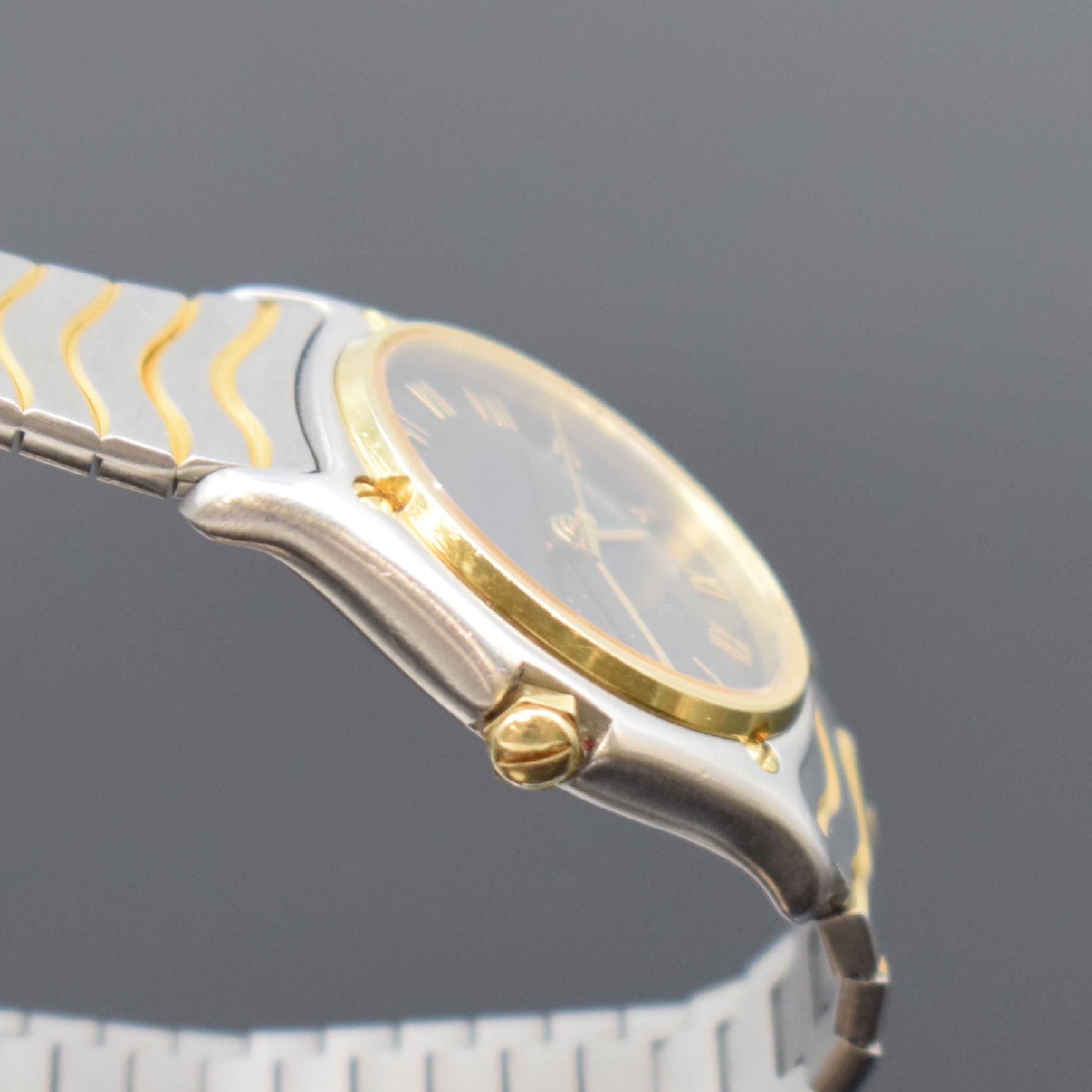 Detail c: EBEL Damenarmbanduhr Classic Wave in Stahl/Gold Referenz 183908, Schweiz um 1990, quarz, Lünette gegen Geh. 5-fach verschr. (1 Schraube def.), orig. ...