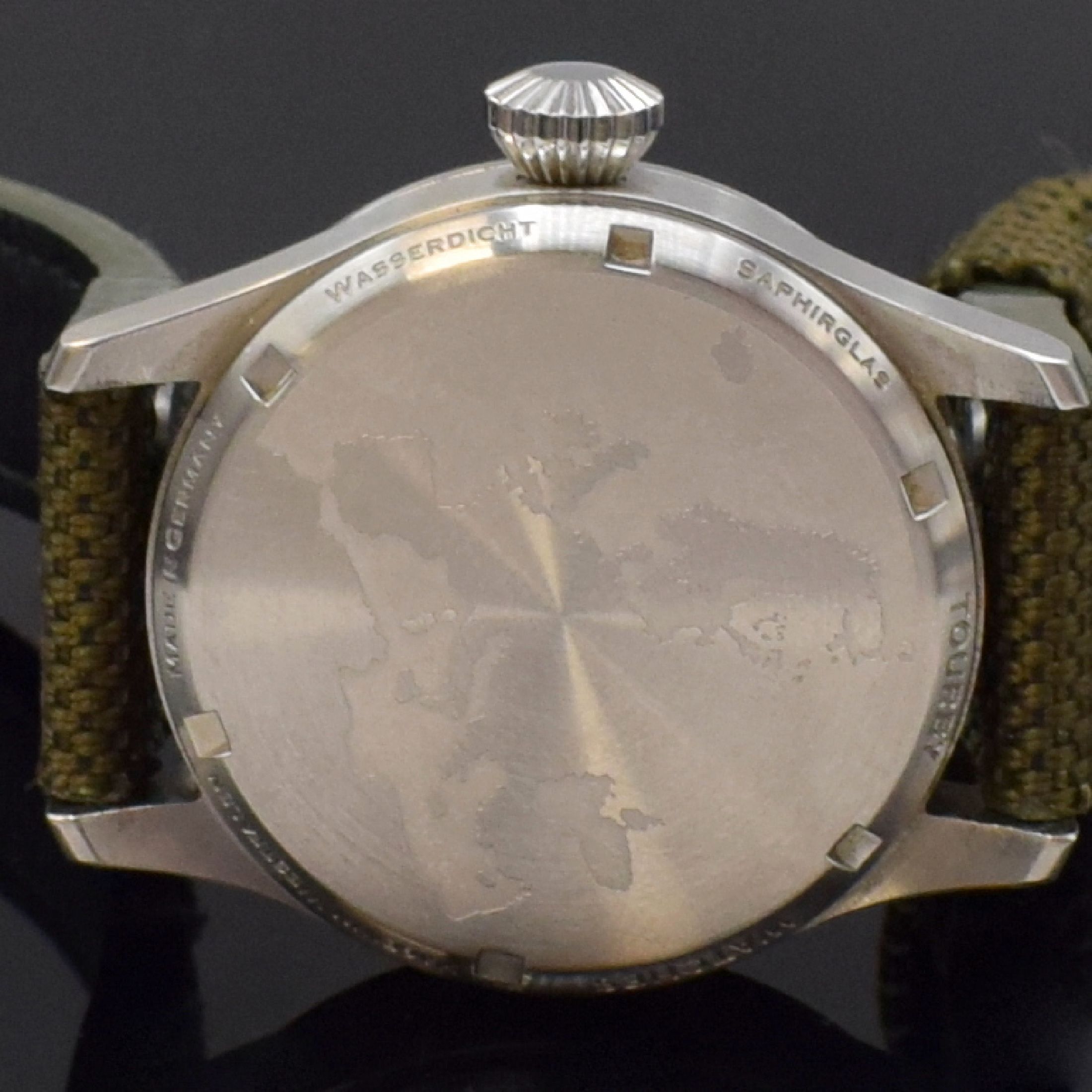 Detail f: TOURBY Aviator Herrenarmbanduhr in Stahl, Deutschland um 2011, Automatik, massives Geh., Boden geschr., Textilband, schwarzes Zifferbl. m. arab. ...