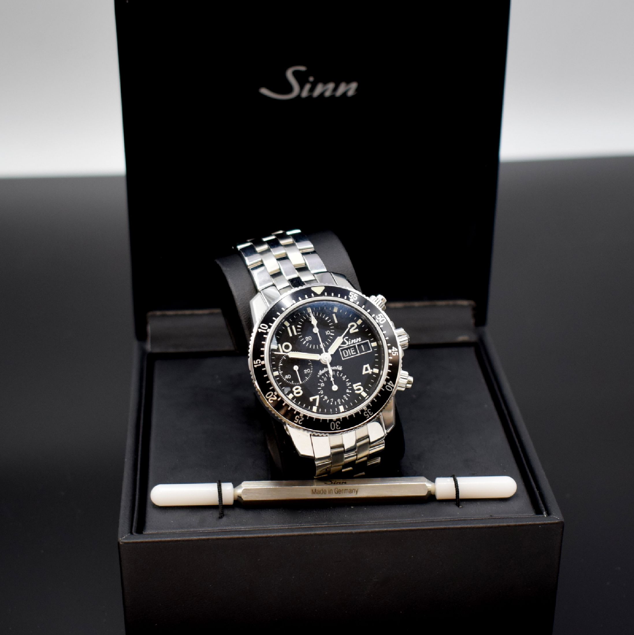 SINN Herrenarmbanduhr mit Chronograph Referenz 103, Deutschland um 2015, Automatik, verschr. Geh. in Edelstahl inkl. orig. Band m. dopp. Faltschl., ...