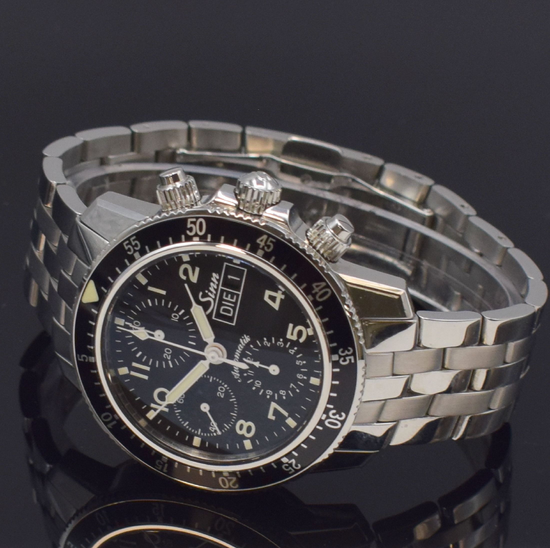 Detail b: SINN Herrenarmbanduhr mit Chronograph Referenz 103, Deutschland um 2015, Automatik, verschr. Geh. in Edelstahl inkl. orig. Band m. dopp. Faltschl., ...