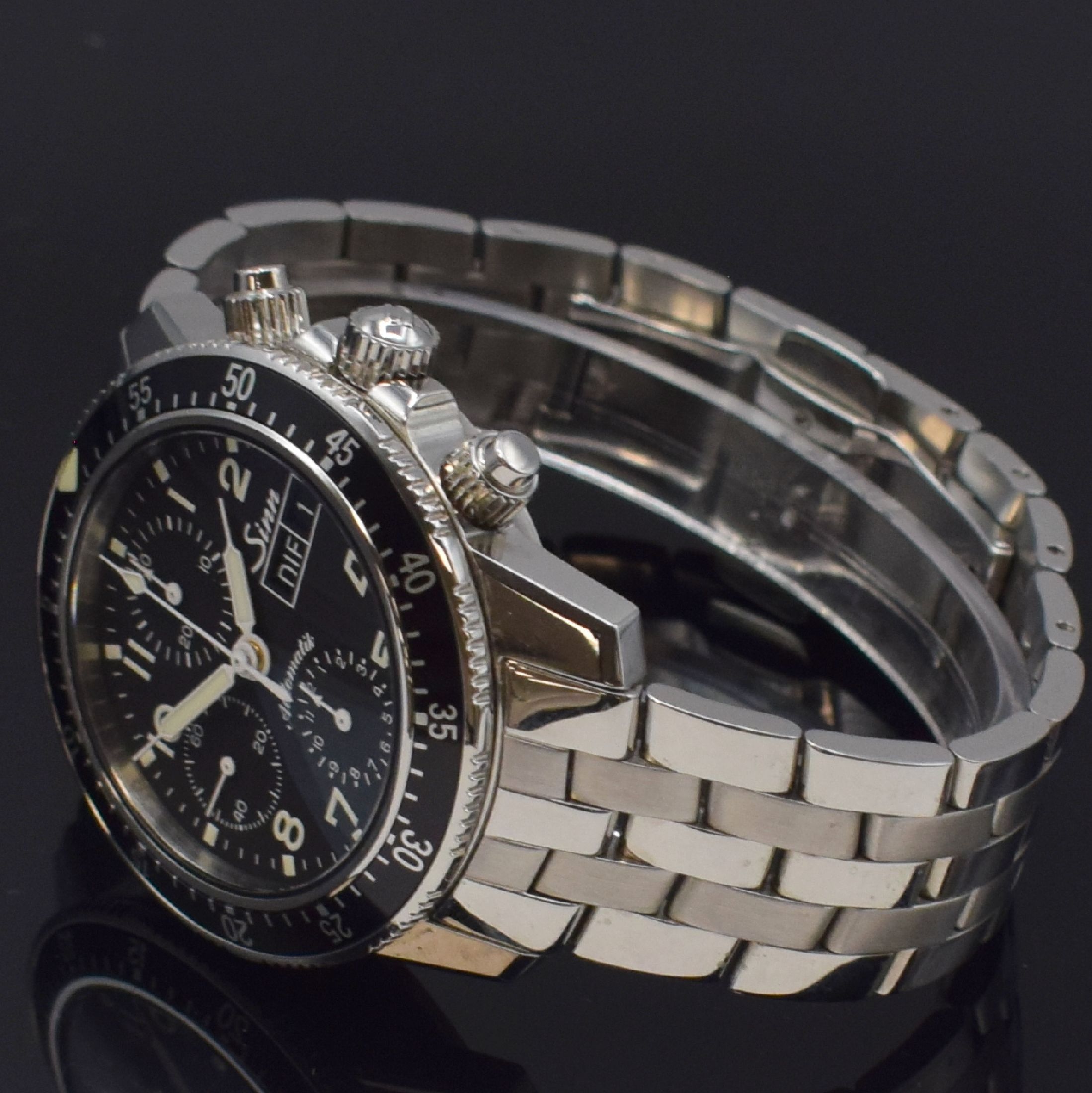 Detail c: SINN Herrenarmbanduhr mit Chronograph Referenz 103, Deutschland um 2015, Automatik, verschr. Geh. in Edelstahl inkl. orig. Band m. dopp. Faltschl., ...