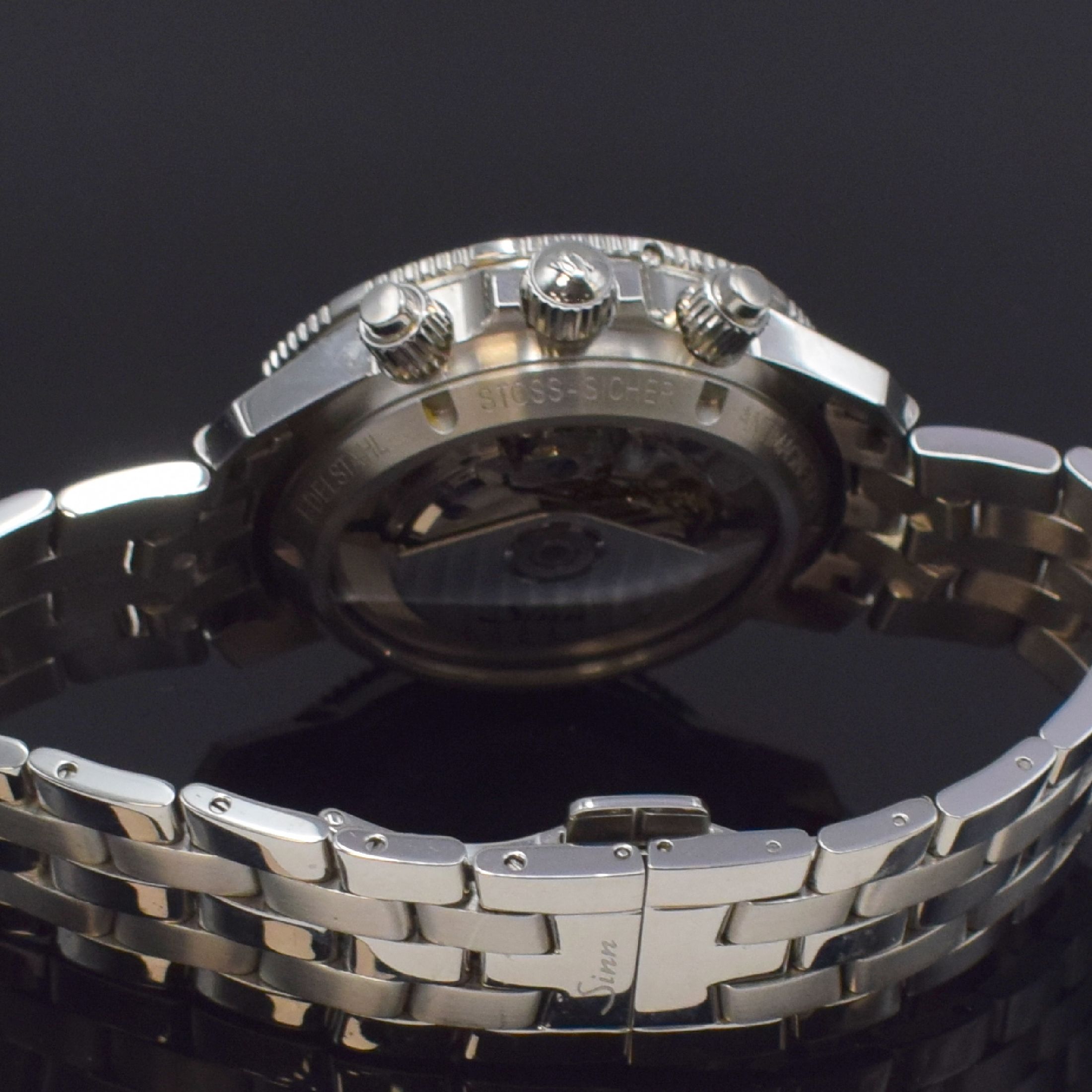 Detail d: SINN Herrenarmbanduhr mit Chronograph Referenz 103, Deutschland um 2015, Automatik, verschr. Geh. in Edelstahl inkl. orig. Band m. dopp. Faltschl., ...