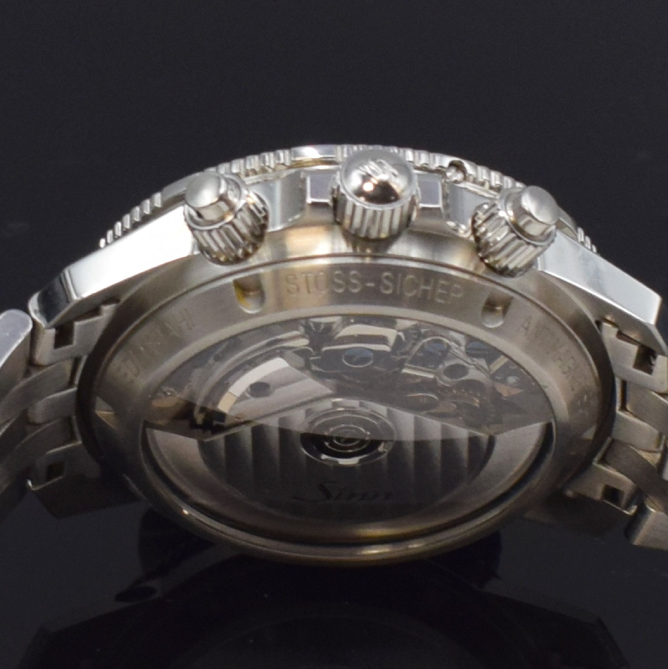 Detail e: SINN Herrenarmbanduhr mit Chronograph Referenz 103, Deutschland um 2015, Automatik, verschr. Geh. in Edelstahl inkl. orig. Band m. dopp. Faltschl., ...