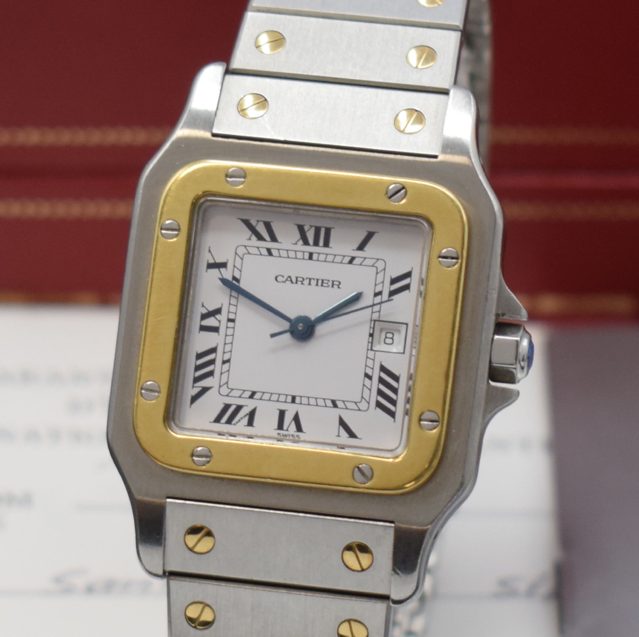 Detail a: CARTIER Santos Herrenarmbanduhr, Schweiz um 1985, Automatik, Edelstahl/Gold kombiniert inkl. Gliederband m. Faltschl., Monocoque- Geh., Lünette ...
