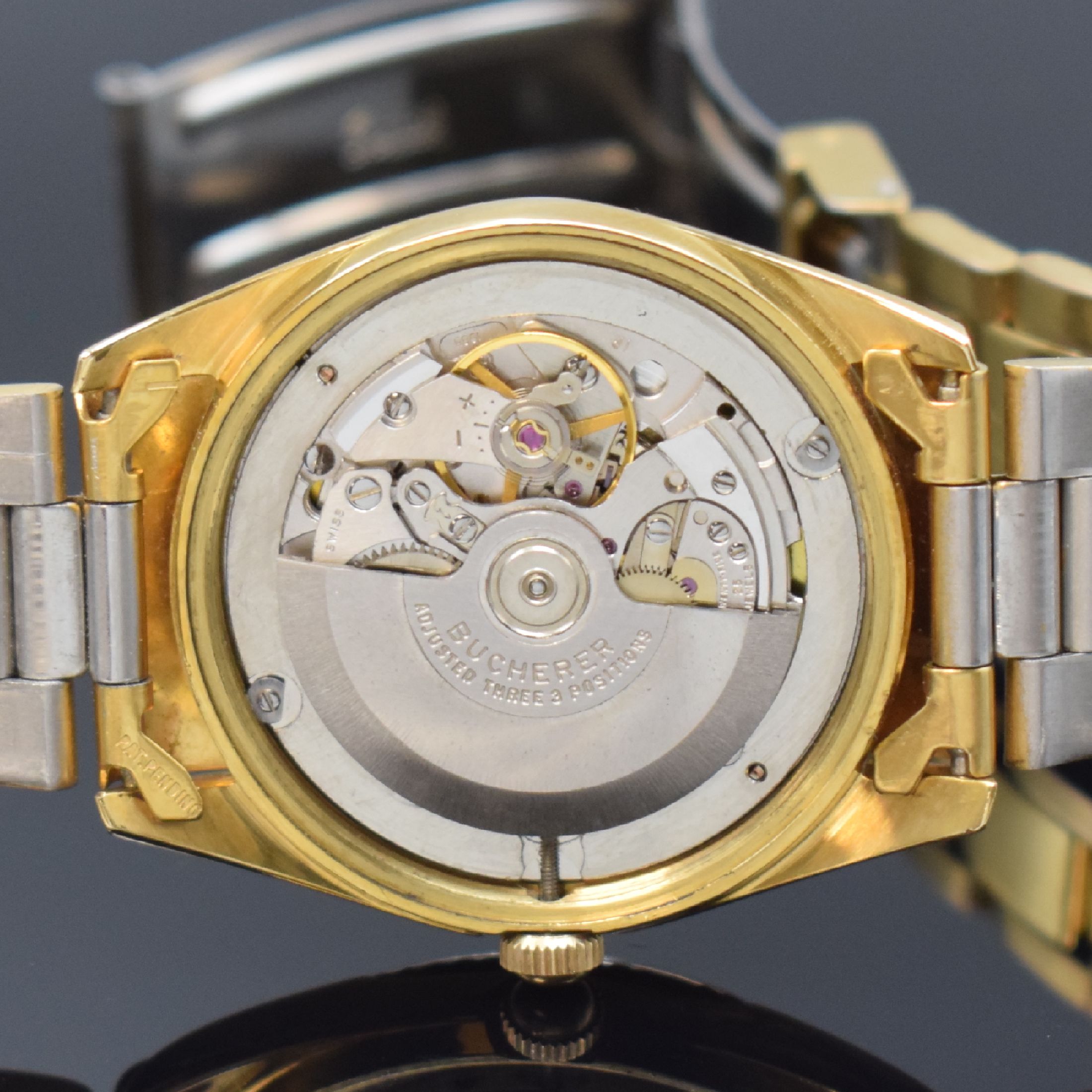 Detail e: BUCHERER Herrenarmbanduhr Weekday Referenz 30 139, Automatik, Schweiz um 1968, verg. Geh. inkl. Gliederband Faltschl., Edelstahlboden m. ...