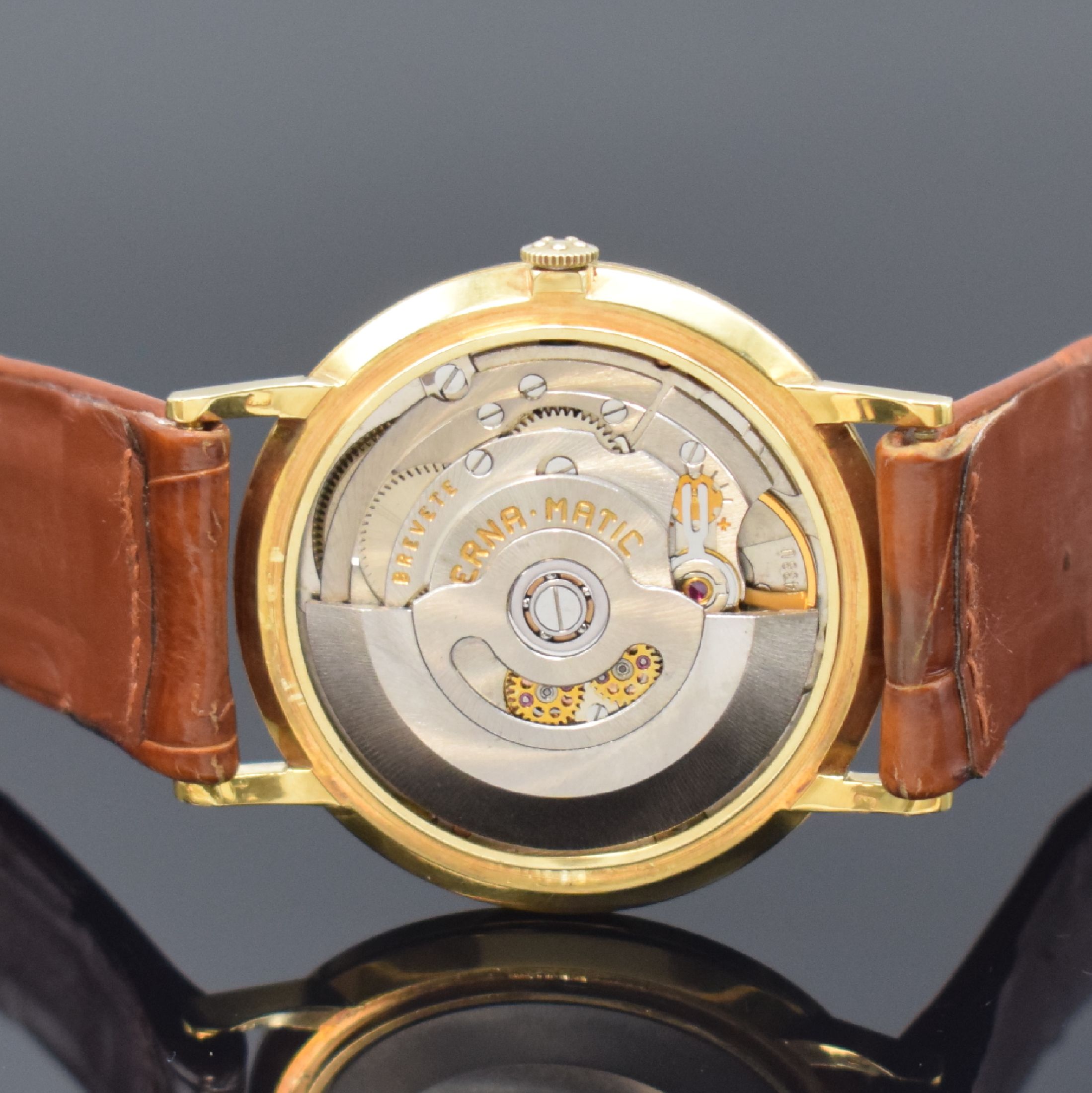Detail e: ETERNA Centenaire Herrenarmbanduhr in GG 750/000, Automatik, Schweiz um 1965, 3-teil. Geh. inkl. orig. Lederband m. verg. orig. Dornschl., orig. Glas ...