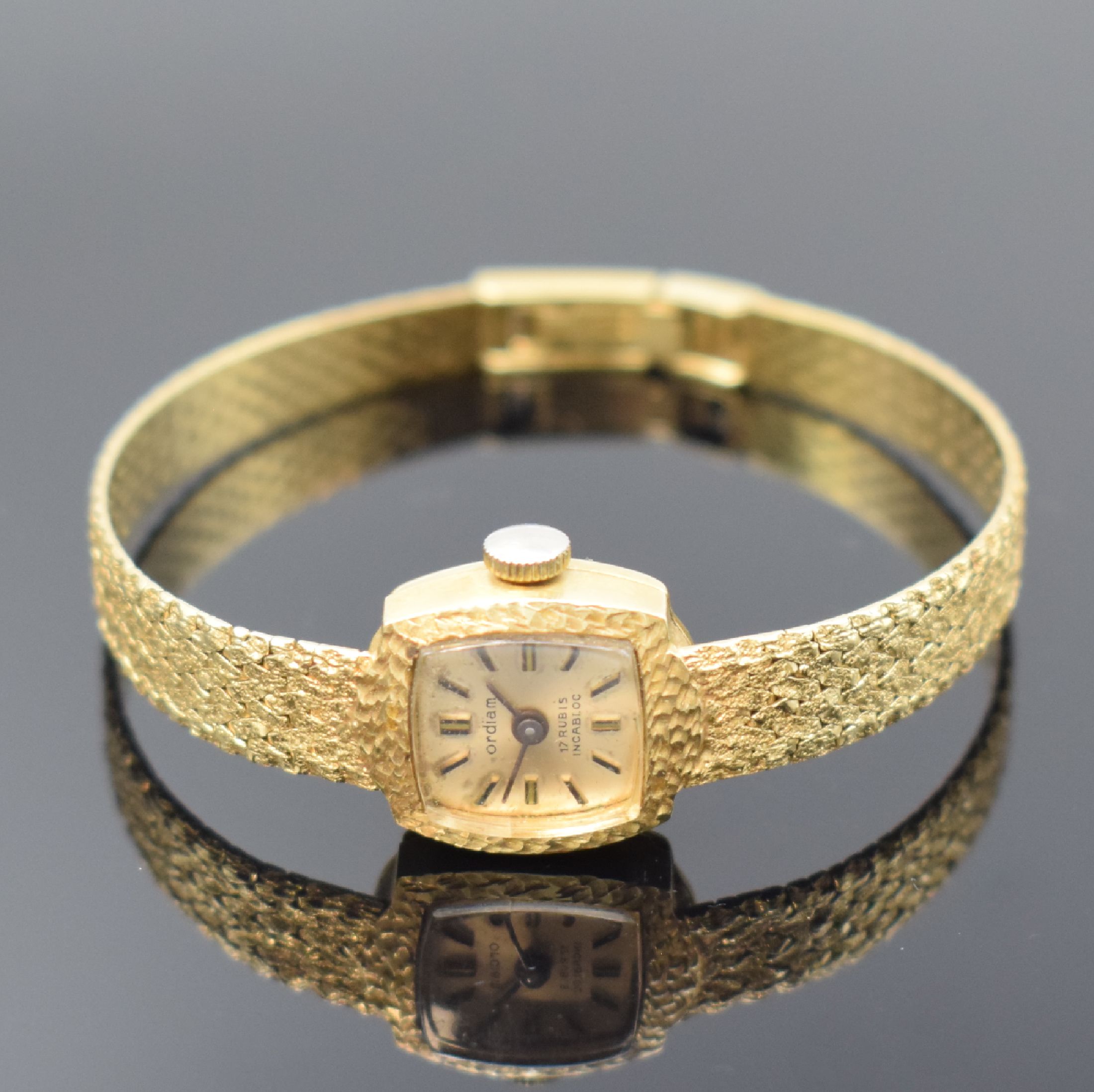 ORDIAM Damengoldbanduhr in GG 585/000, Schweiz um 1975, Handaufzug, GG 585/000 Band, Boden aufgedr., silb. Zifferbl. pat., aufgel. Std.-Ind., M. ca. ...