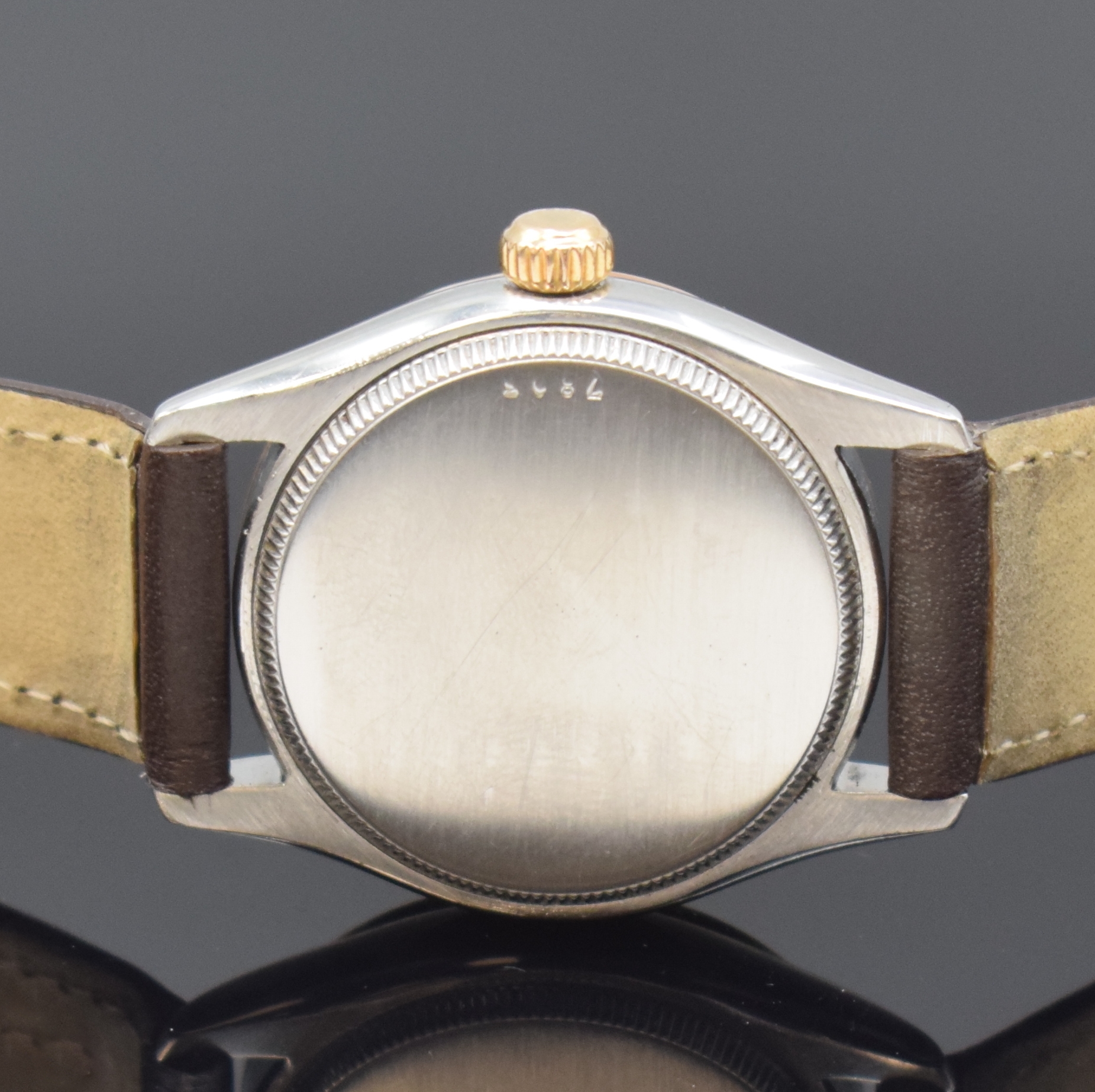Detail c: TUDOR Oyster Armbanduhr in Stahl/Gold Referenz 7803, Schweiz um 1955, Handaufzug, Boden u. Krone verschr., cremefarb. Zifferbl. rest., gold. ...
