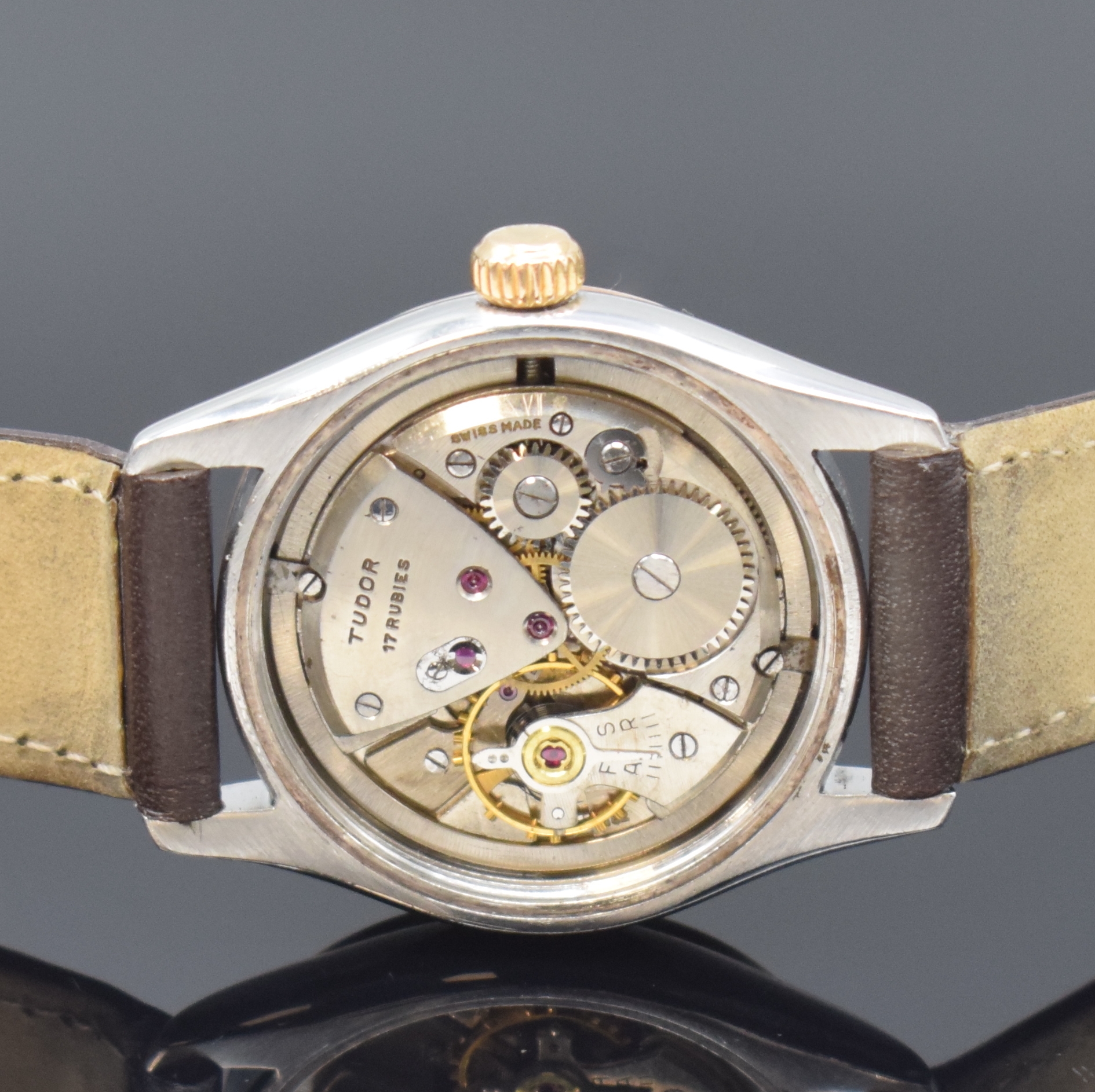 Detail d: TUDOR Oyster Armbanduhr in Stahl/Gold Referenz 7803, Schweiz um 1955, Handaufzug, Boden u. Krone verschr., cremefarb. Zifferbl. rest., gold. ...