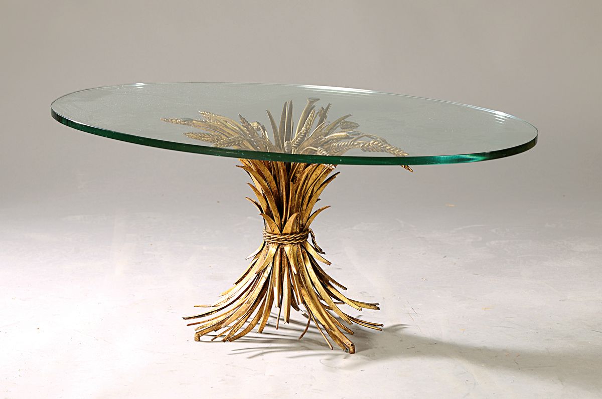 Beistelltisch, in der Art von Maison Bagues, Unterbau in Form von Getreidegarben aus goldfarbenem Metall, ovale Glasplatte, H. ca. 40cm, Platte ca. ...