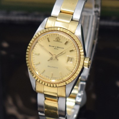 26651241a - BAUME & MERCER ladies wristwatch Baumatic reference 1215 2, self winding, stainless steel/gold combined including bracelet with deployant clasp, screwed down case back, fluted bezel, gold-plated dial with raised indices, display of hours, minutes, sweep seconds & date, diameter approx. 25 mm, length approx. 17 cm, original box and papers, sold in September 1975, condition 2, property of a collector