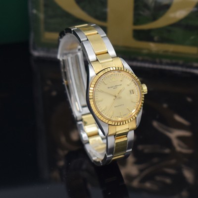 26651241c - BAUME & MERCER ladies wristwatch Baumatic reference 1215 2, self winding, stainless steel/gold combined including bracelet with deployant clasp, screwed down case back, fluted bezel, gold-plated dial with raised indices, display of hours, minutes, sweep seconds & date, diameter approx. 25 mm, length approx. 17 cm, original box and papers, sold in September 1975, condition 2, property of a collector