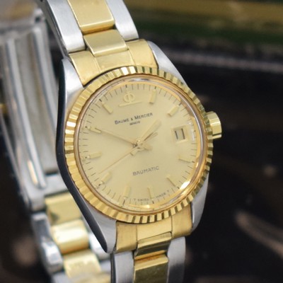 26651241d - BAUME & MERCER ladies wristwatch Baumatic reference 1215 2, self winding, stainless steel/gold combined including bracelet with deployant clasp, screwed down case back, fluted bezel, gold-plated dial with raised indices, display of hours, minutes, sweep seconds & date, diameter approx. 25 mm, length approx. 17 cm, original box and papers, sold in September 1975, condition 2, property of a collector
