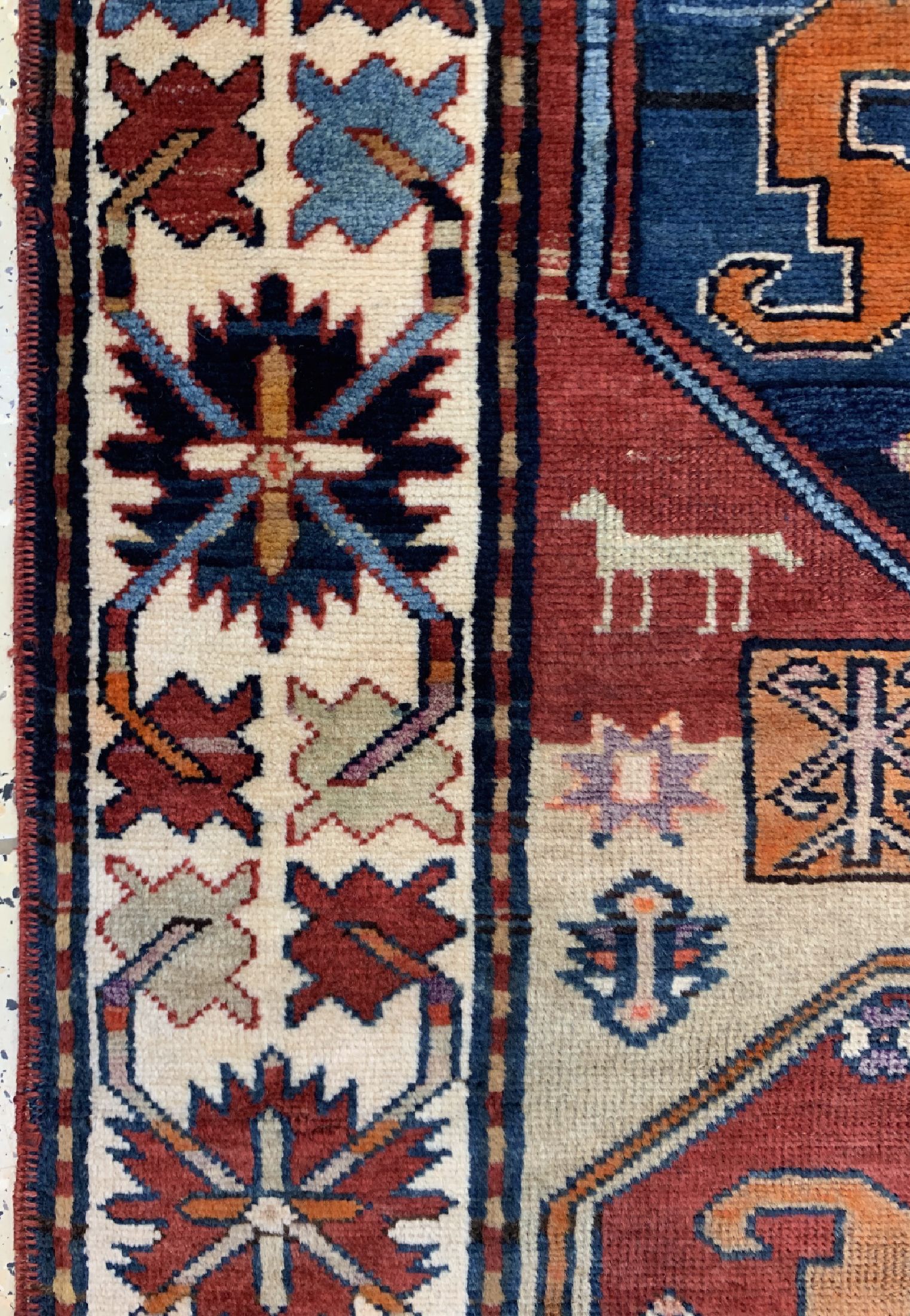 Detail e: Wolkenband Kazak antik, Kaukasus, datiert 1895 , Wolle auf Wolle, ca. 278 x 114 cm, EHZ: 3(Alte Restaurierungen).