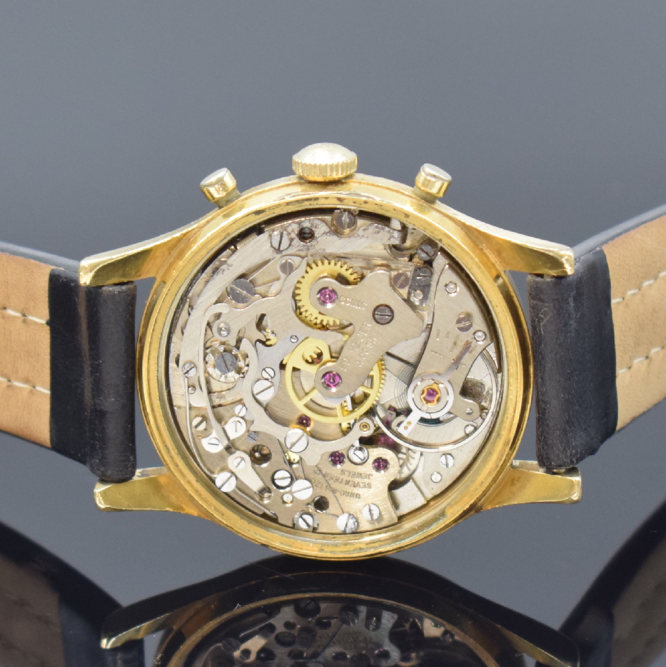 Detail d: HEUER Schaltradchronograph im vergoldeten Gehäuse, Schweiz um 1965, Handaufzug, Geh. m. verschr. Stahlboden, silb. orig. Zifferbl., gold. Indizes u. ...
