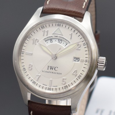 26651640a - IWC Die Fliegeruhr Spitfire UTC, self winding, reference 325/07, screwed down case back and winding crown, neutral leather strap with original buckle, silvered dial with Arabic numerals, luminous hands, date at 3, diameter approx. 39 mm, warranty papers enclosed, bezel with small dent, condition 2