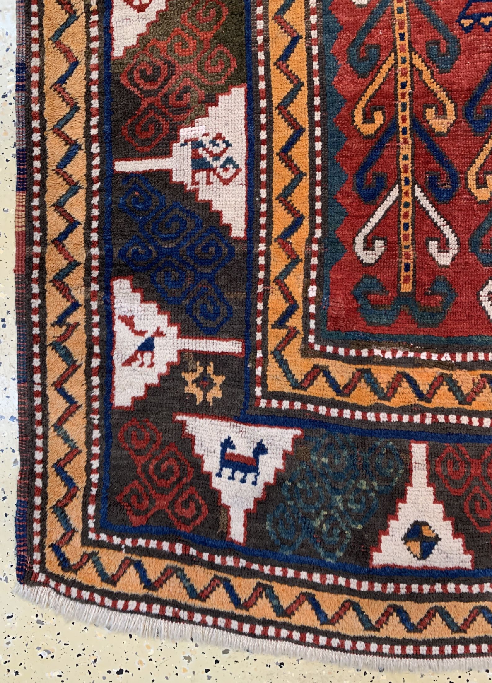 Detail a: Antiker Schildkazak, Kaukasus, 19.Jhd, Wolle auf Wolle, ca. 233 x 175 cm, EHZ: 2-3
