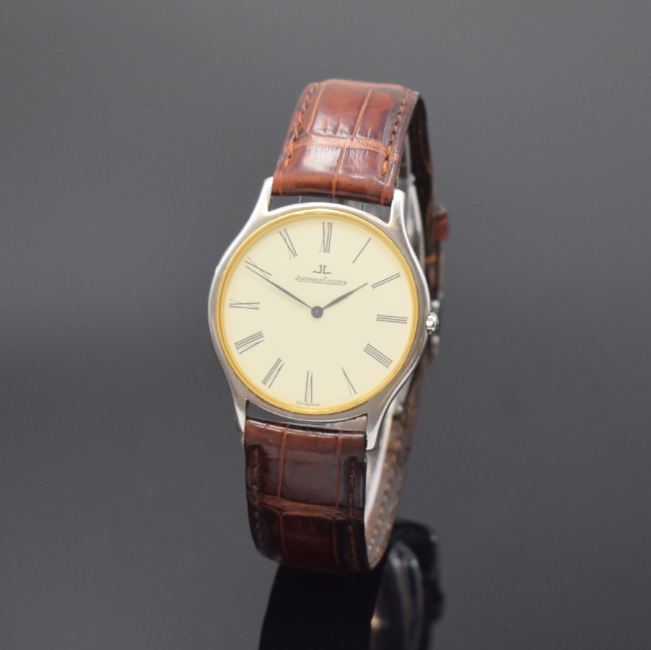 Jaeger-LeCoultre Heraion flache Herrenarmbanduhr in Stahl/Gold Referenz 140.112.5, Schweiz um 1995, quarz, neutr. Lederband m. orig. dopp. Faltschl., ...