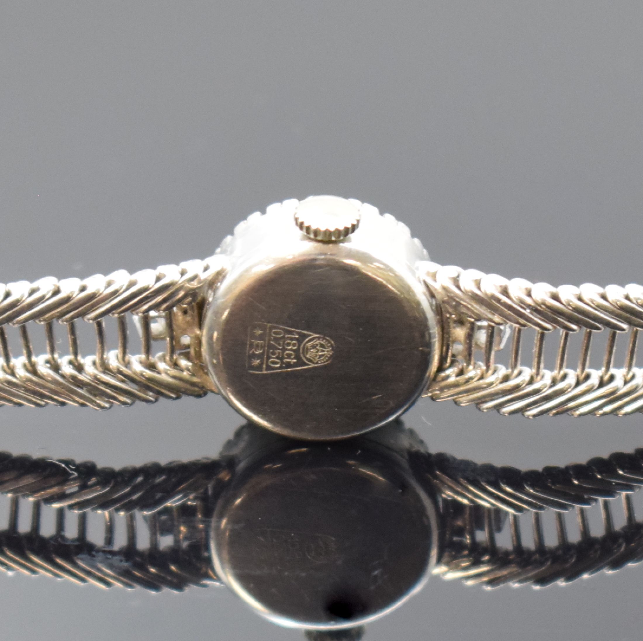 Detail c: CITO Damenarmbanduhr in WG 750/000 mit Diamanten, Schweiz um 1955, Handaufzug, Boden aufgedr., Lünette aufw. m. Diamanten bes., silb. Zifferbl. m. ...