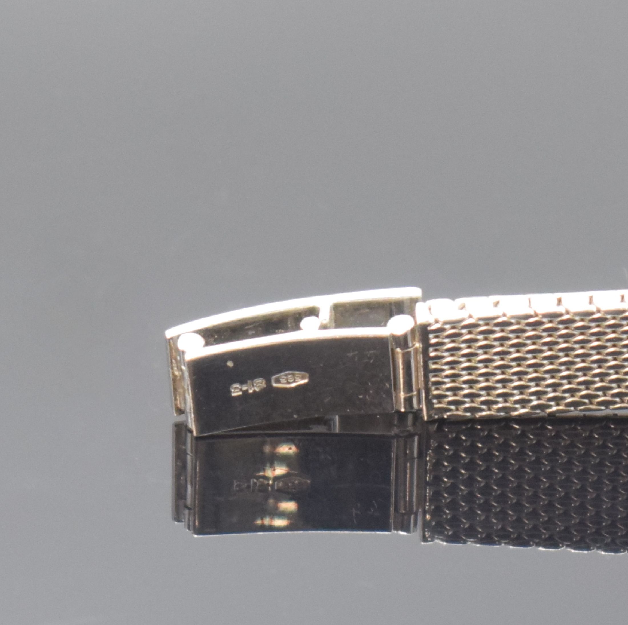 Detail b: GHC Damenarmbanduhr in WG 585/000, Schweiz um 1970, Handaufzug, 2-teil. Geh., Boden aufgedr., Milanaiseband, Lünette m. Diamanten bes., silb. ...
