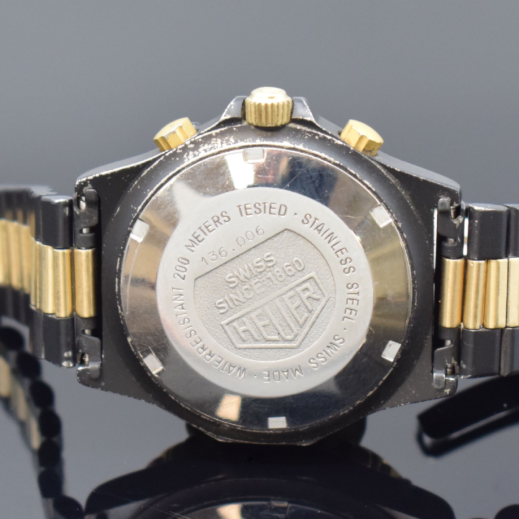 Detail d: HEUER 3000 seltene Herrenarmbanduhr mit Chronograph Referenz 136.006, Schweiz um 1985, Automatik, Stahlgehäuse teils verg. bzw. geschwärzt, orig. ...
