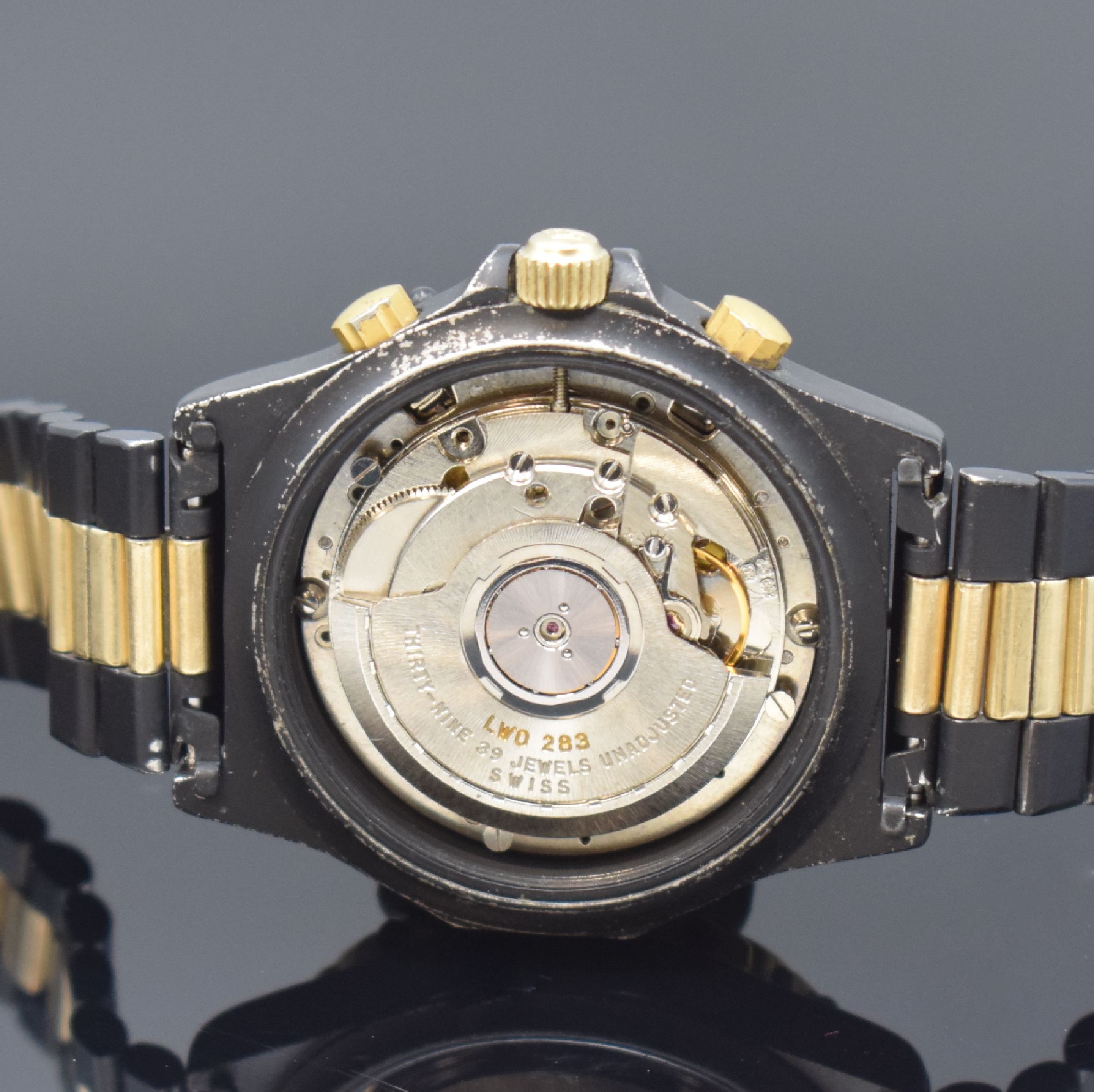 Detail e: HEUER 3000 seltene Herrenarmbanduhr mit Chronograph Referenz 136.006, Schweiz um 1985, Automatik, Stahlgehäuse teils verg. bzw. geschwärzt, orig. ...