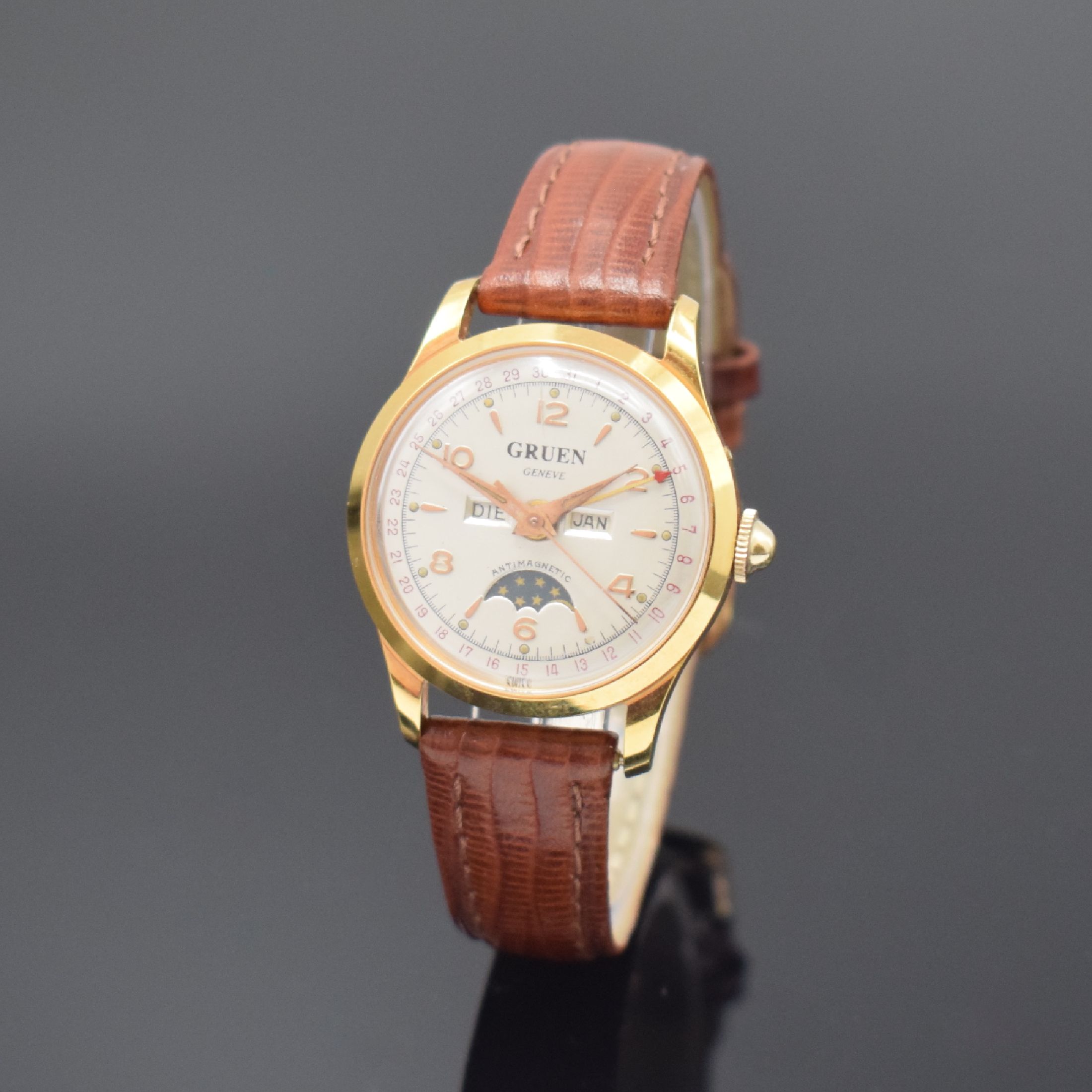 GRUEN Damenarmbanduhr mit Vollkalender und Mondphase, Schweiz um 1950, Handaufzug, verg. Geh., Lunette u. Stahlboden aufgedr., silb. Zifferbl., ...