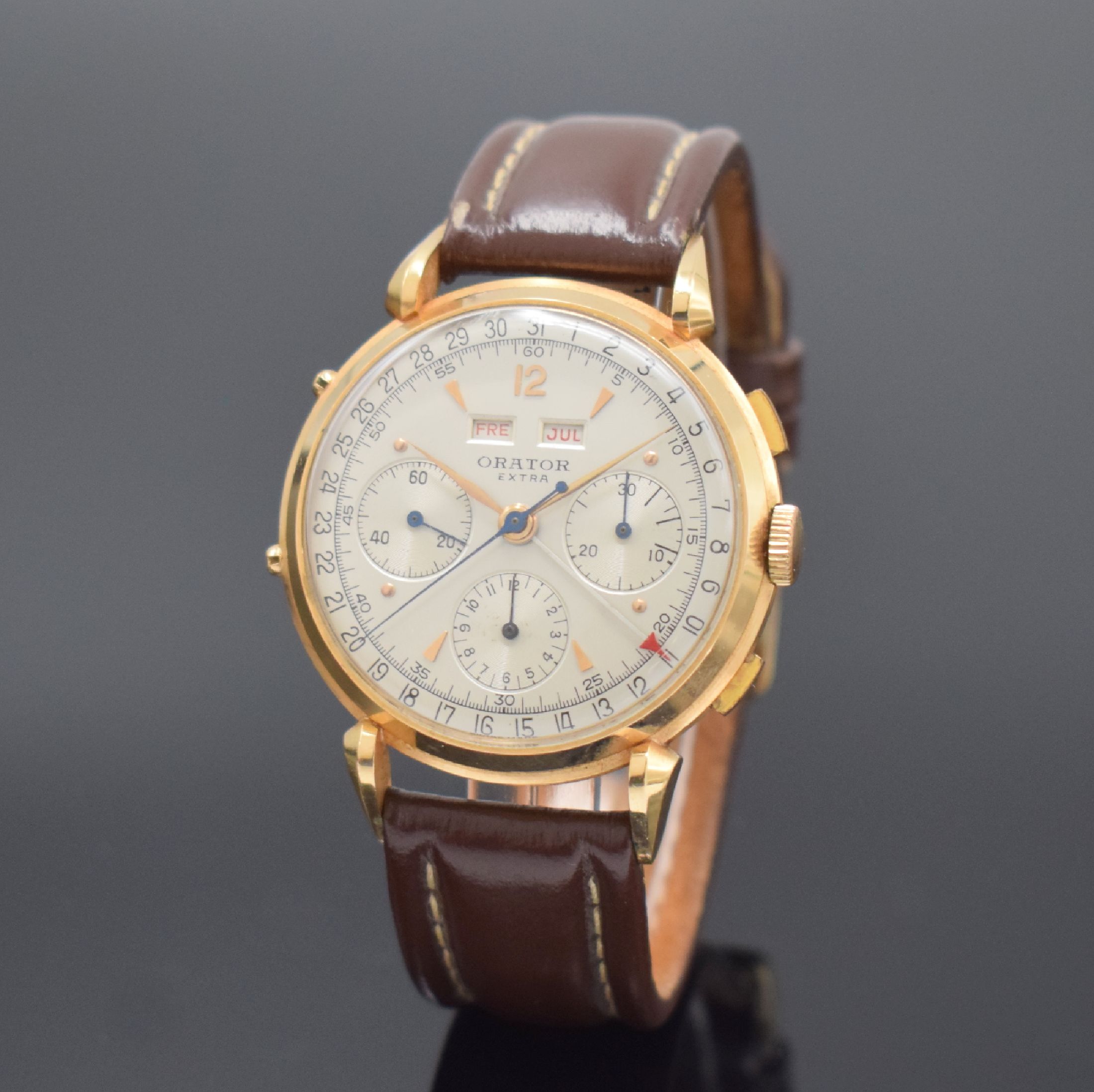 ORATOR Extra Schaltradchronograph Valjoux 72C mit Vollkalender in RG 750/000, Schweiz um 1945, Handaufzug, 3-tlg. Geh. m. ausgefallenen ...